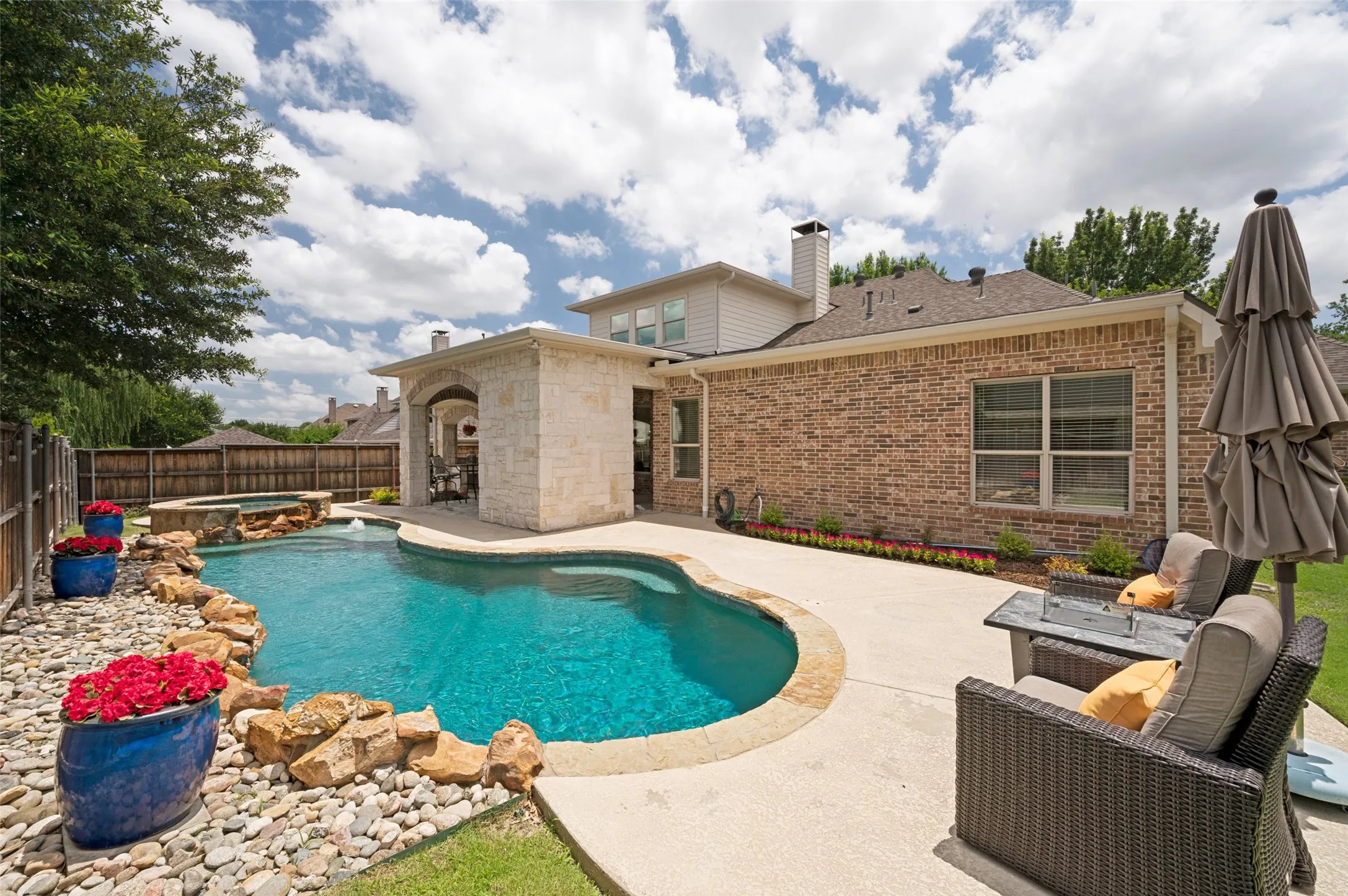 Get ready for summer fun with this salt water pool and plenty of seating.
