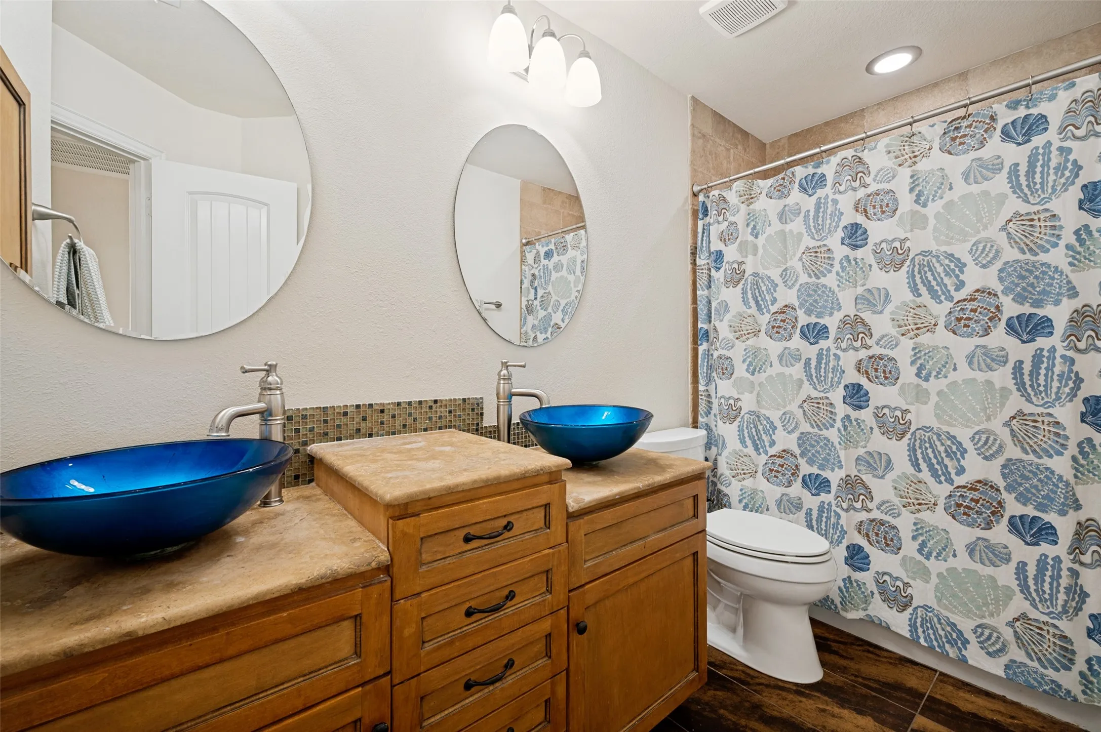 Secondary bath with decorative bowl sinks