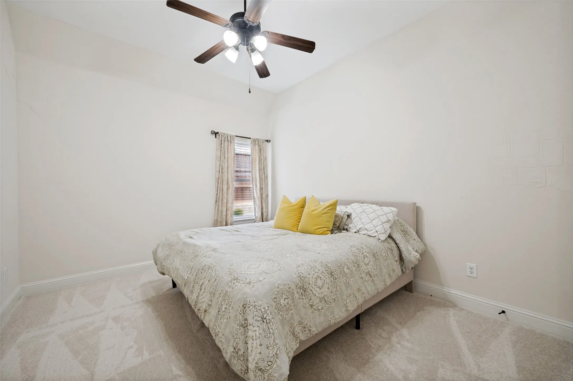 Secondary bedroom with new carpet.