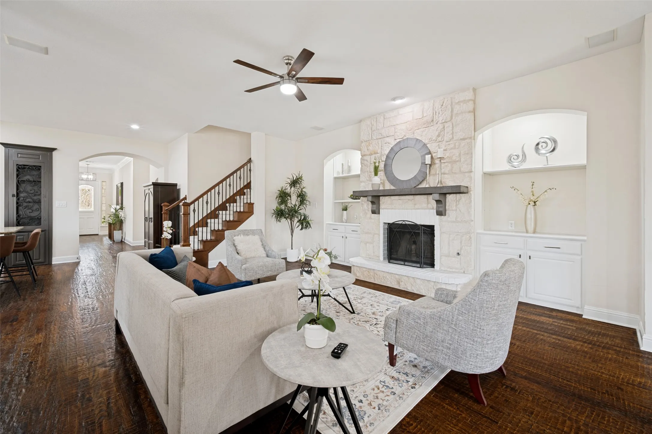 Main living area has a cozy fireplace and lighted built in cabinets.