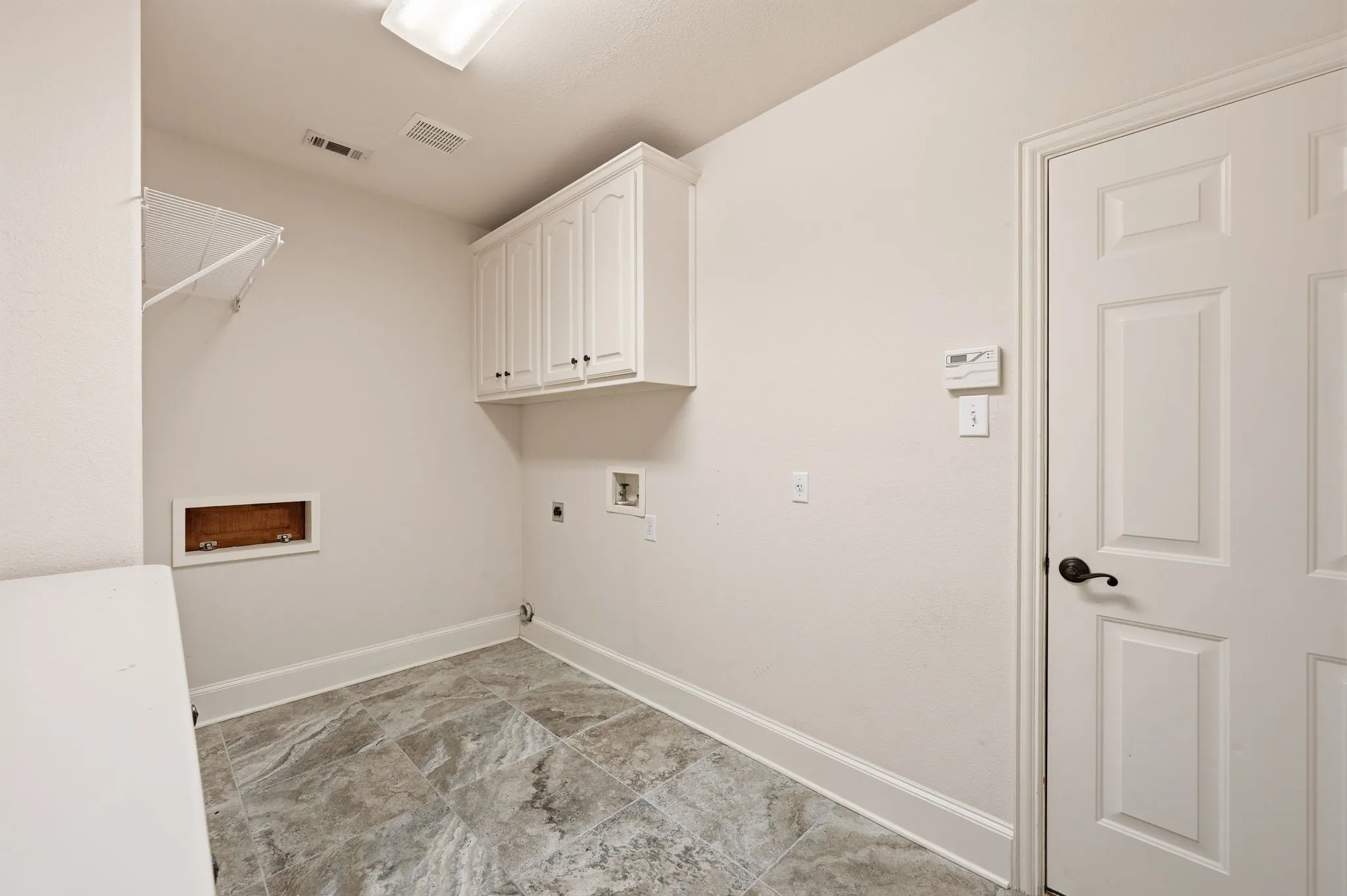 Laundry Room with Built in Cabinets.