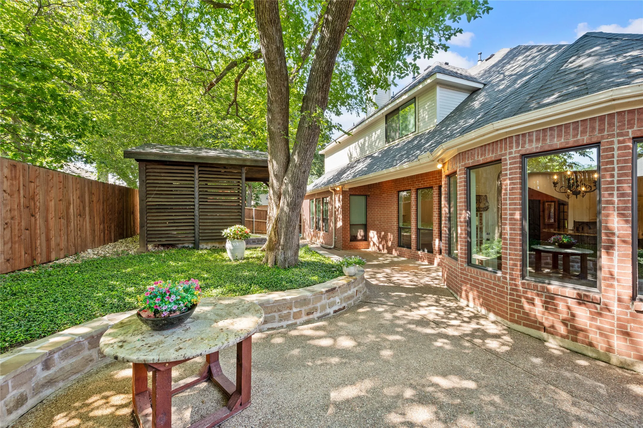 Backyard with a Covered and Open Patio.