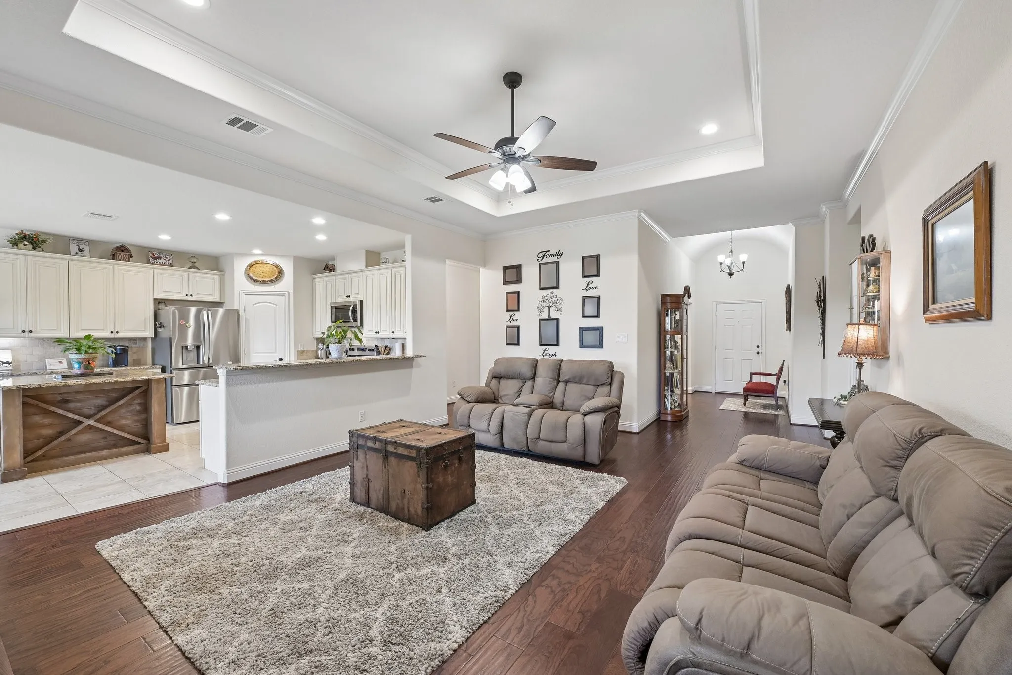 Open-concept living area with dark wood-finish flooring