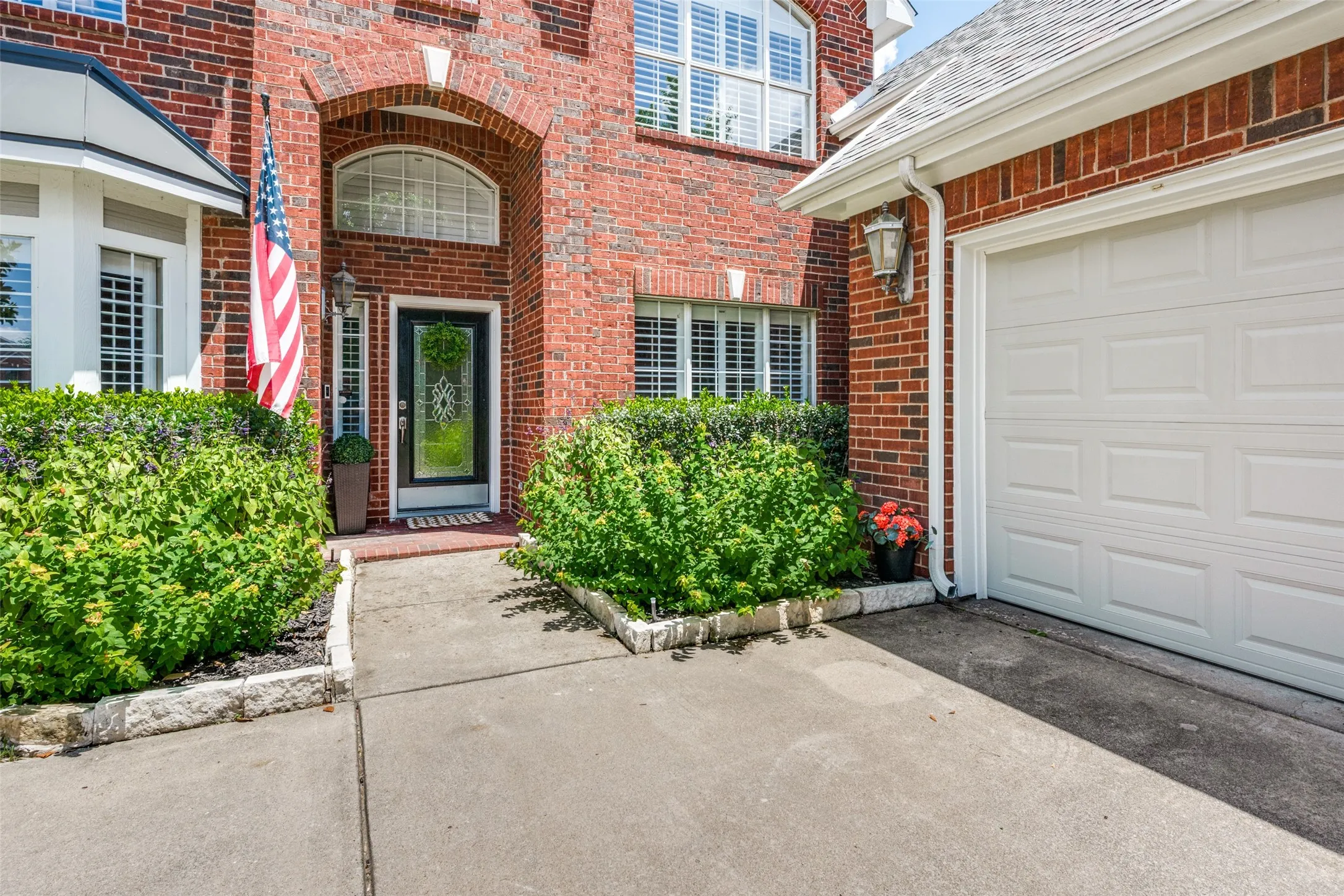 Red brick exterior with an arched entryway