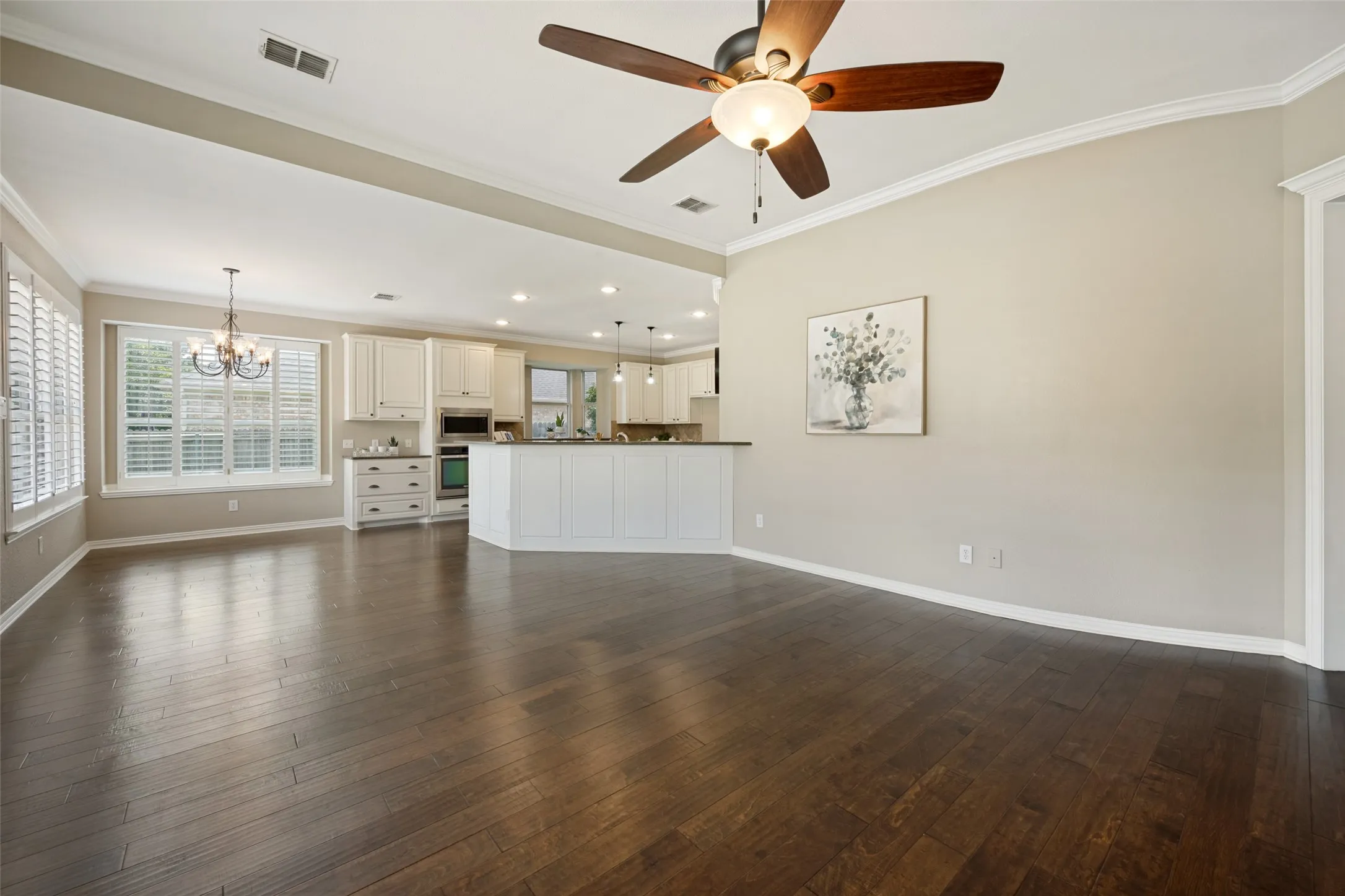 Expansive wood-finish flooring throughout the main living area
