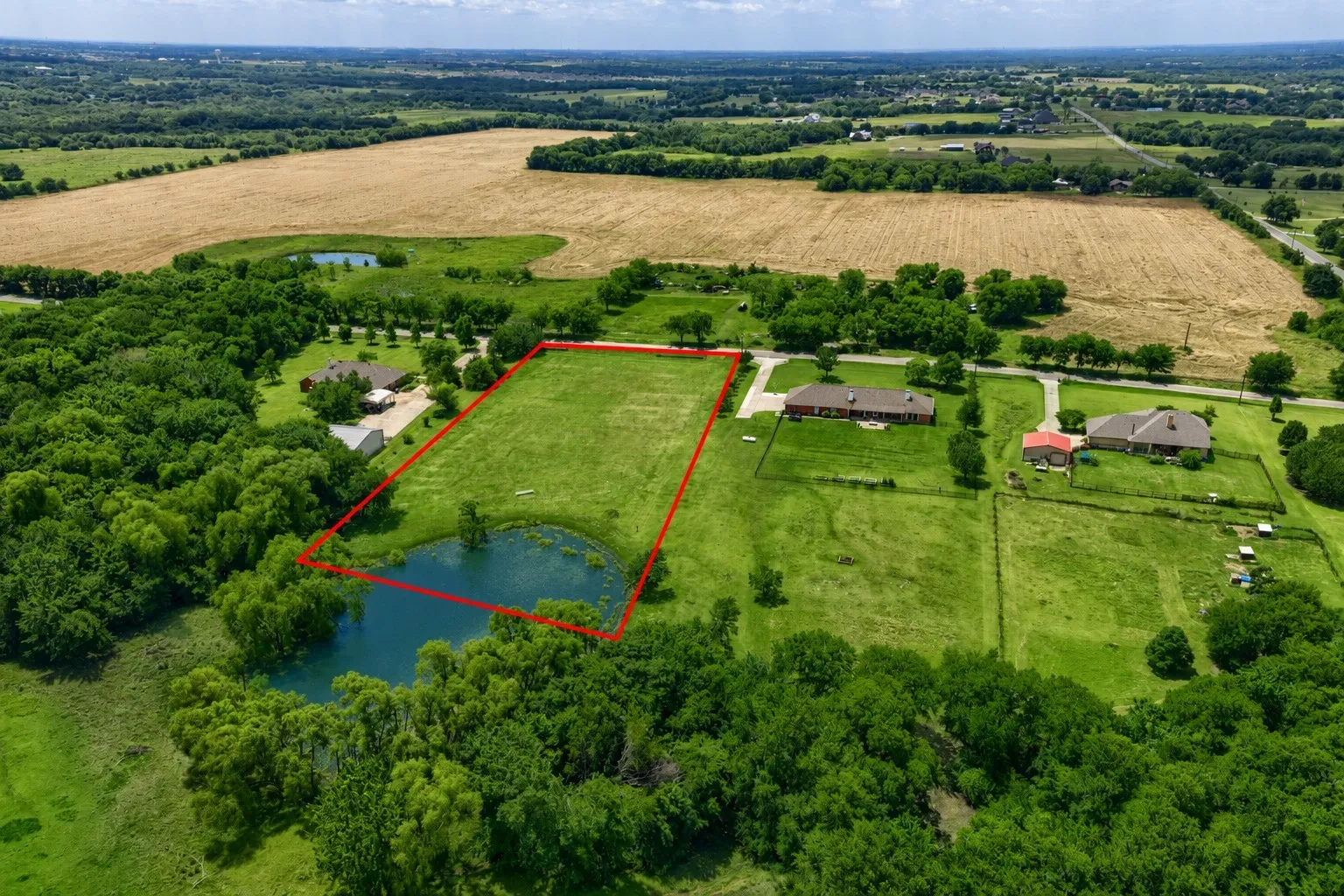 Expansive parcel featuring a private pond and surrounding green space