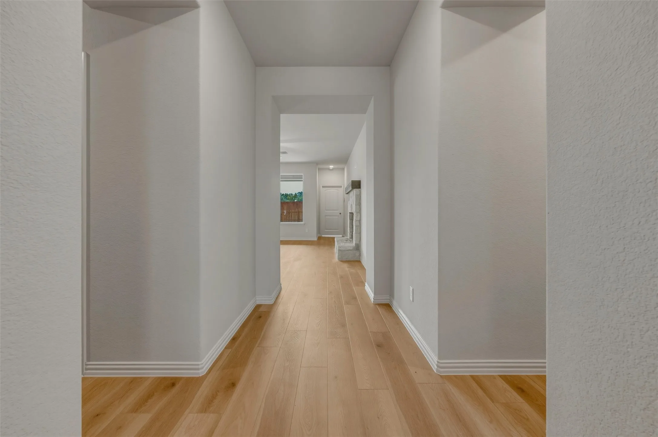 Wood-finish flooring throughout, bright interior paint, and crisp white trimwork