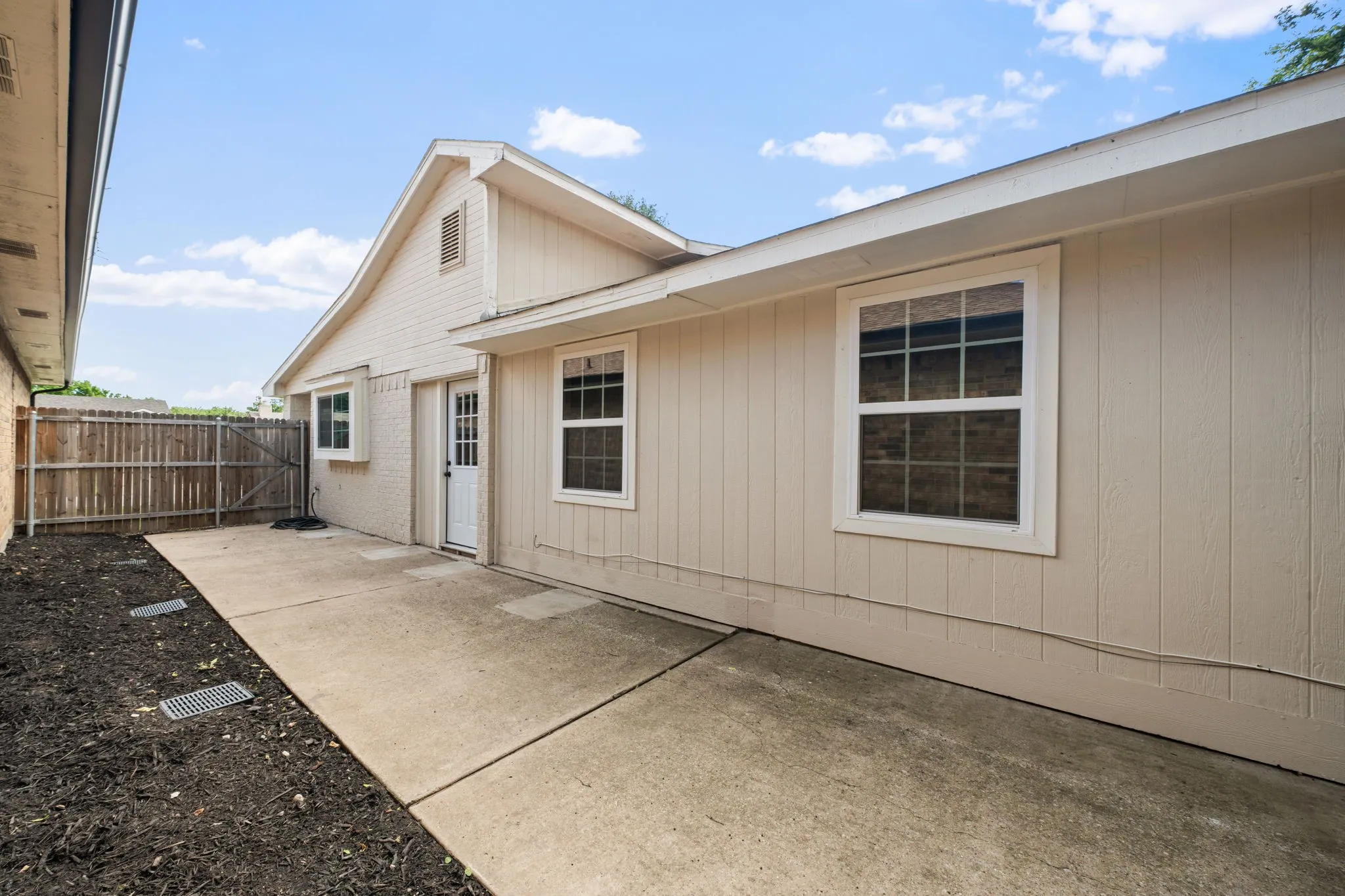 Expansive concrete patio with direct access to the interior