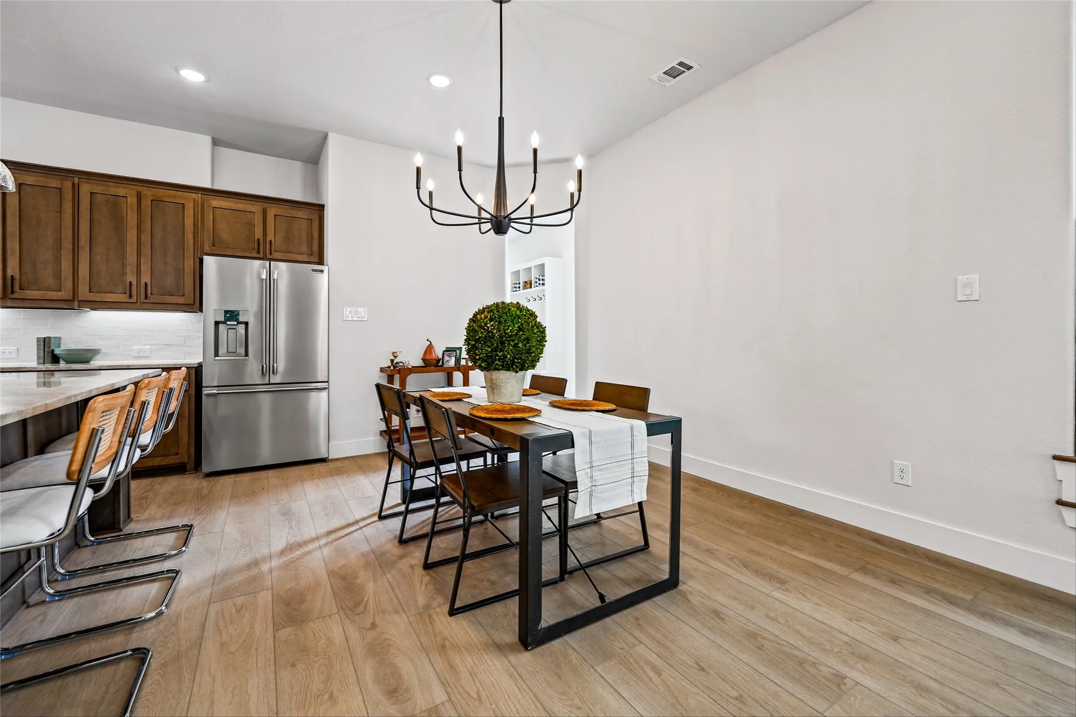 Warm wood-finish flooring extending throughout