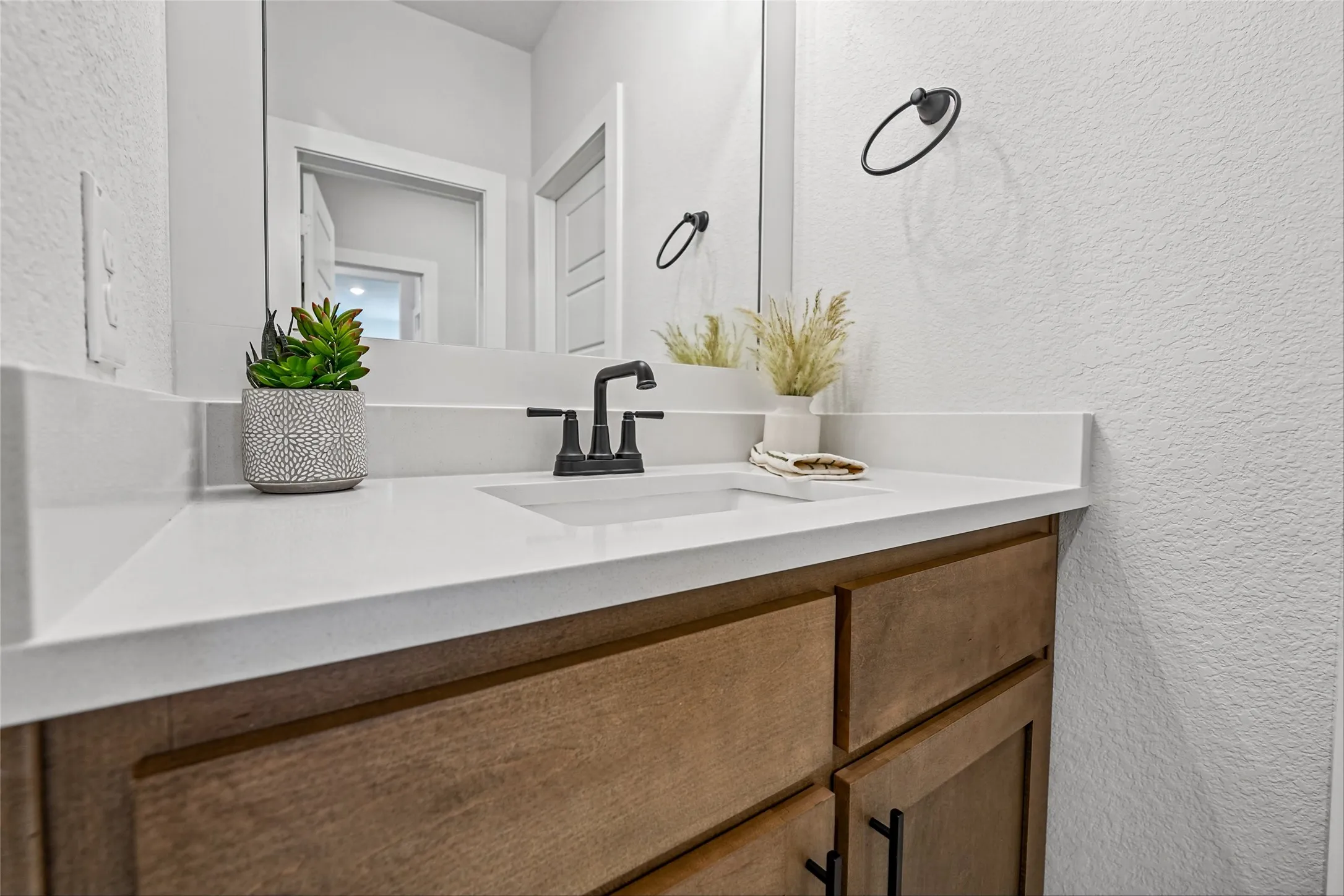 White solid surface countertop with integrated rectangular sink