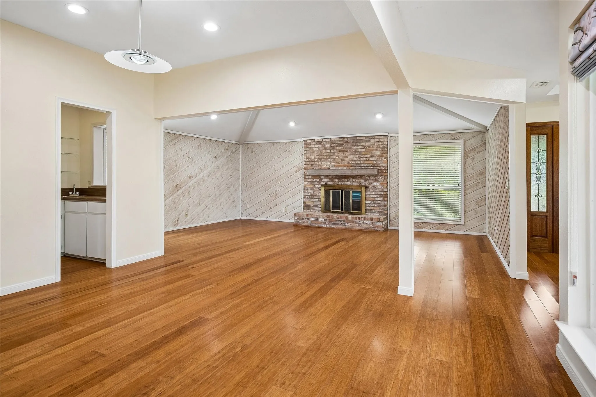 Dining room and living area. Wet bar on left.