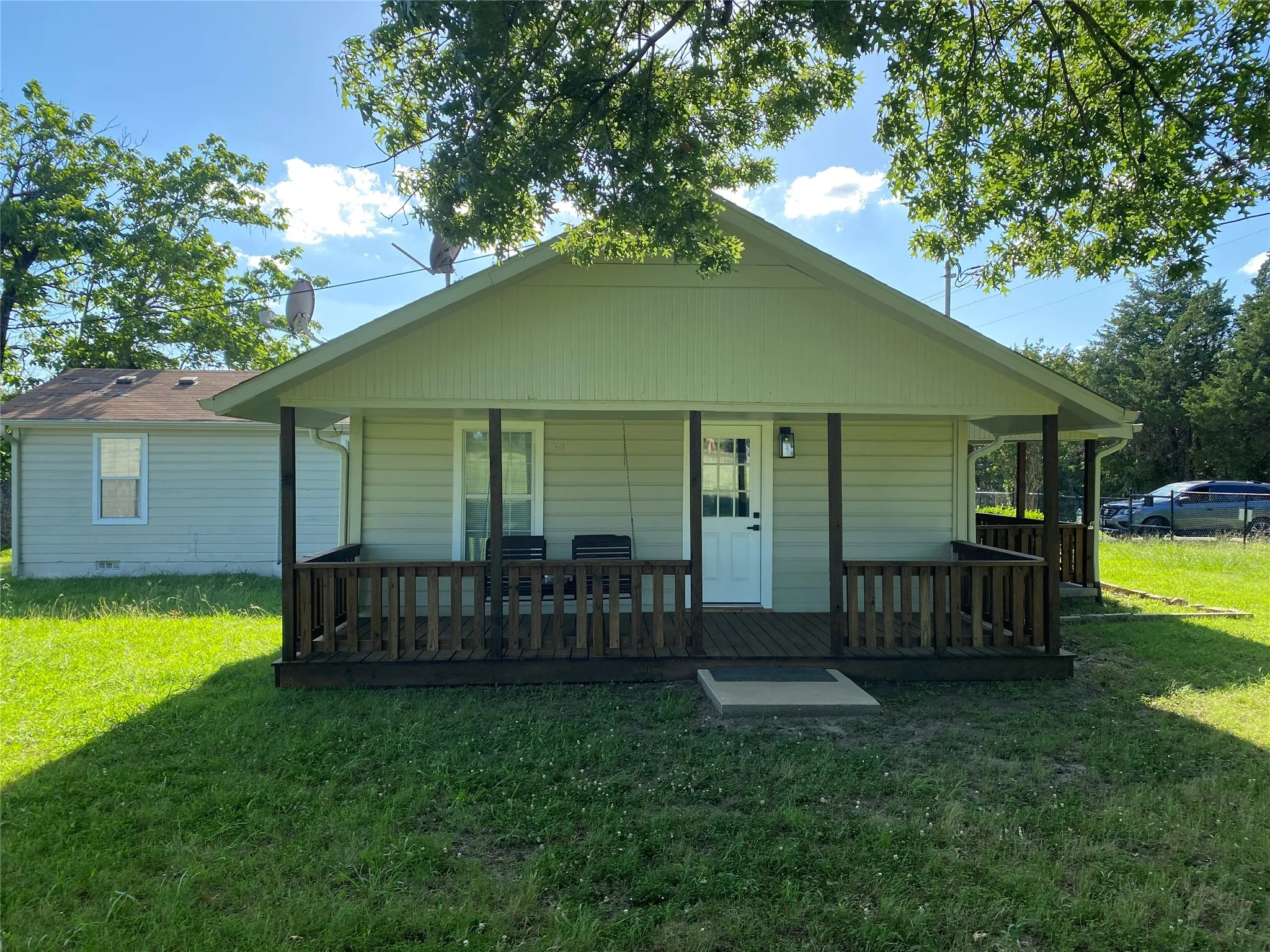Side porch with a swing
