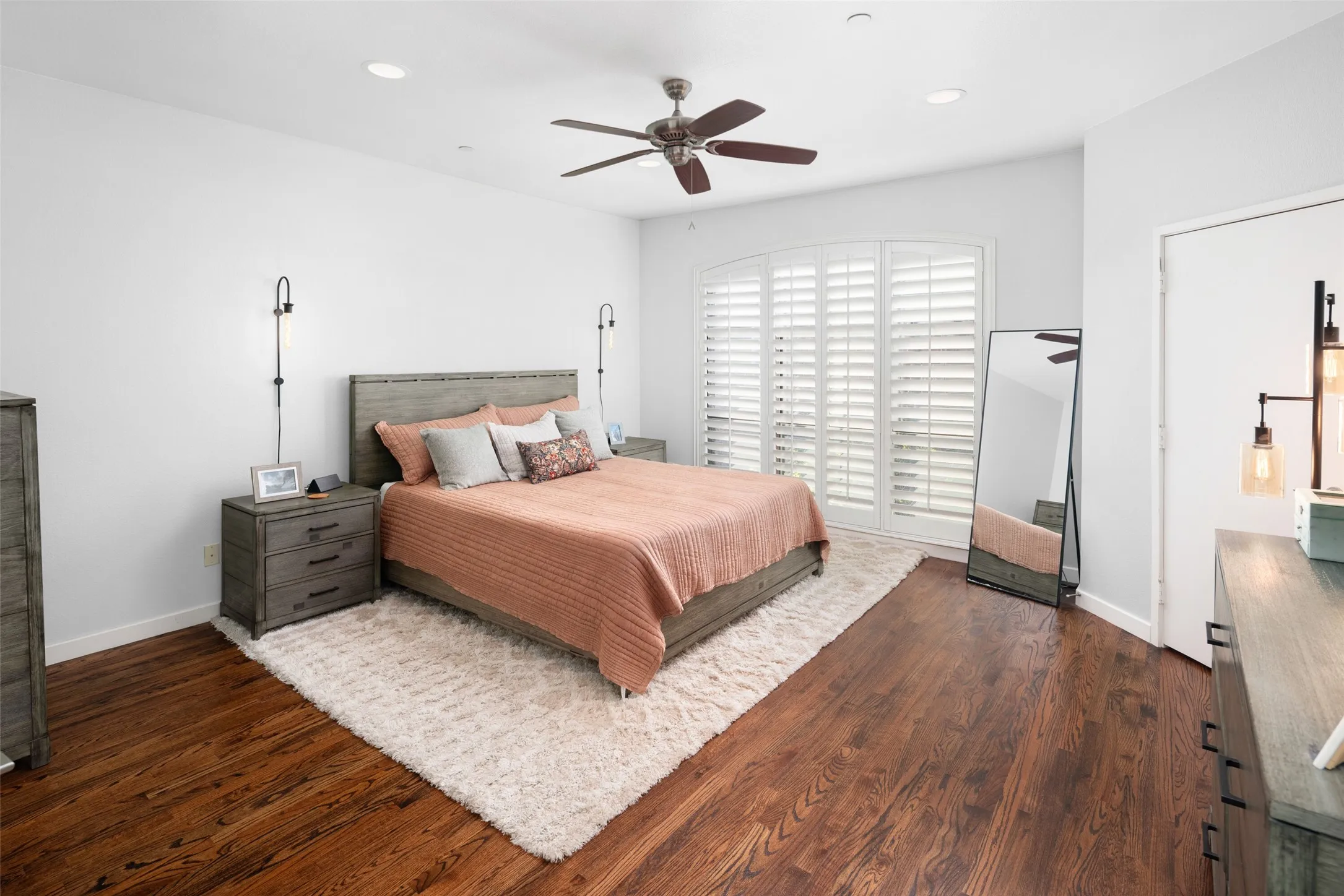 Hardwood flooring throughout featuring recessed lighting and a ceiling fan