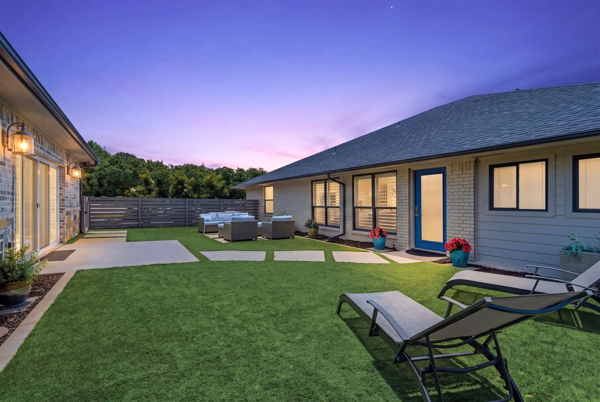 turfed area between main house and indoor pool house