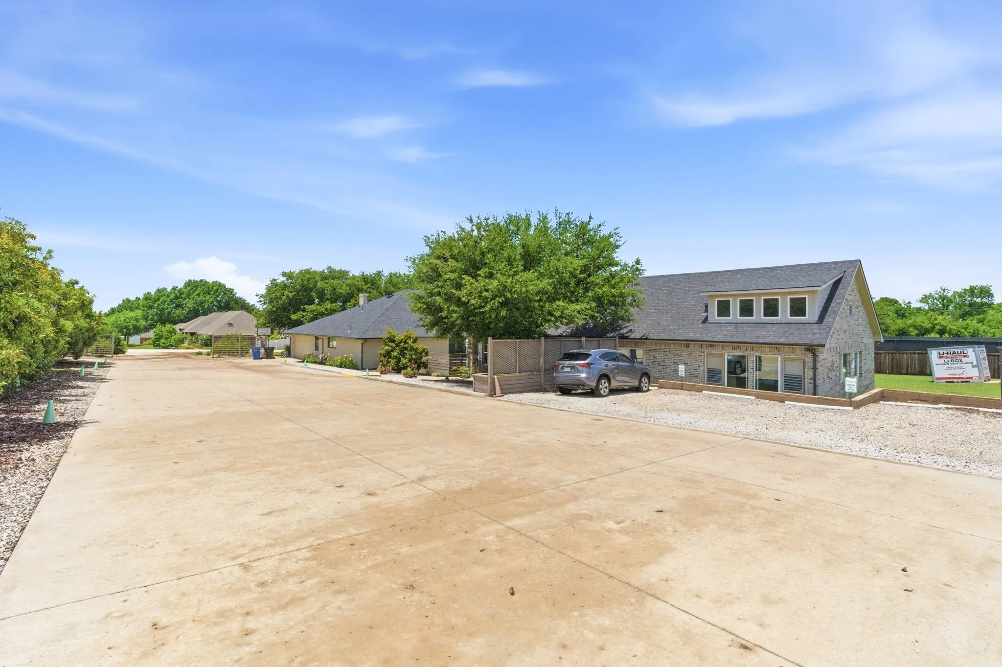 paved parking area outside pool house