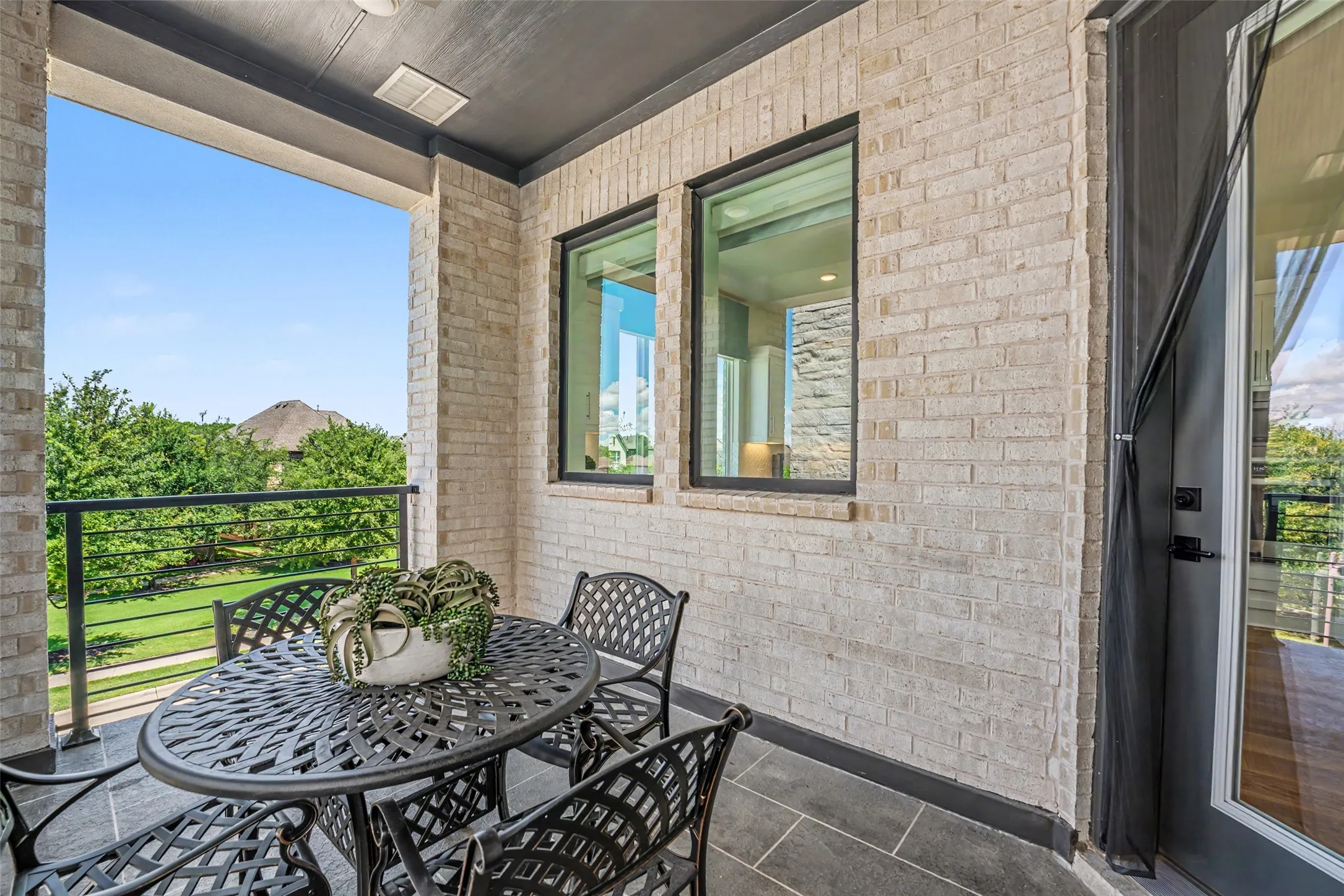 Second Level Covered Balcony with Kitchen Access and Greenbelt Views