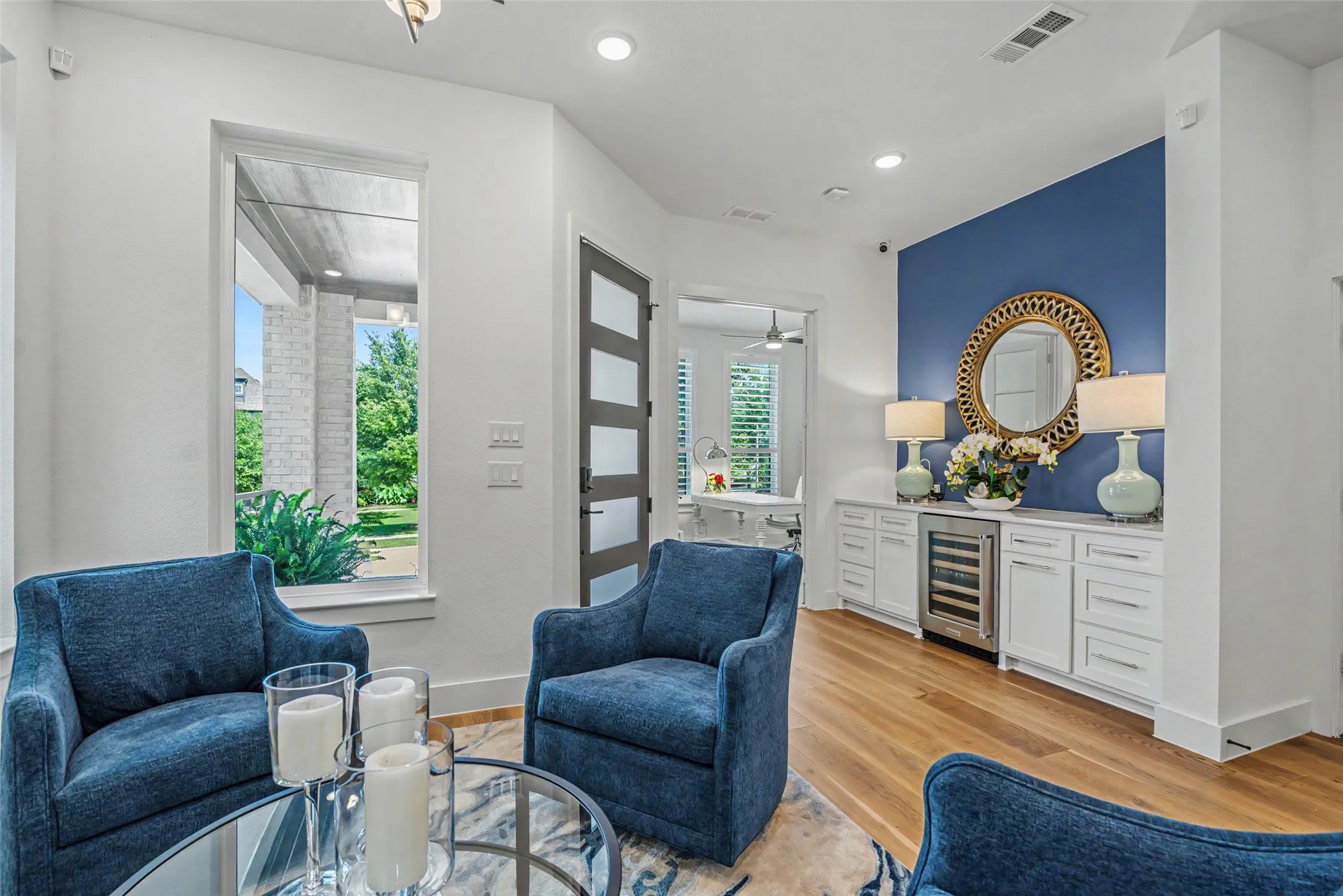 Impressive Entry on the First Level features a Living Area and Dry Bar