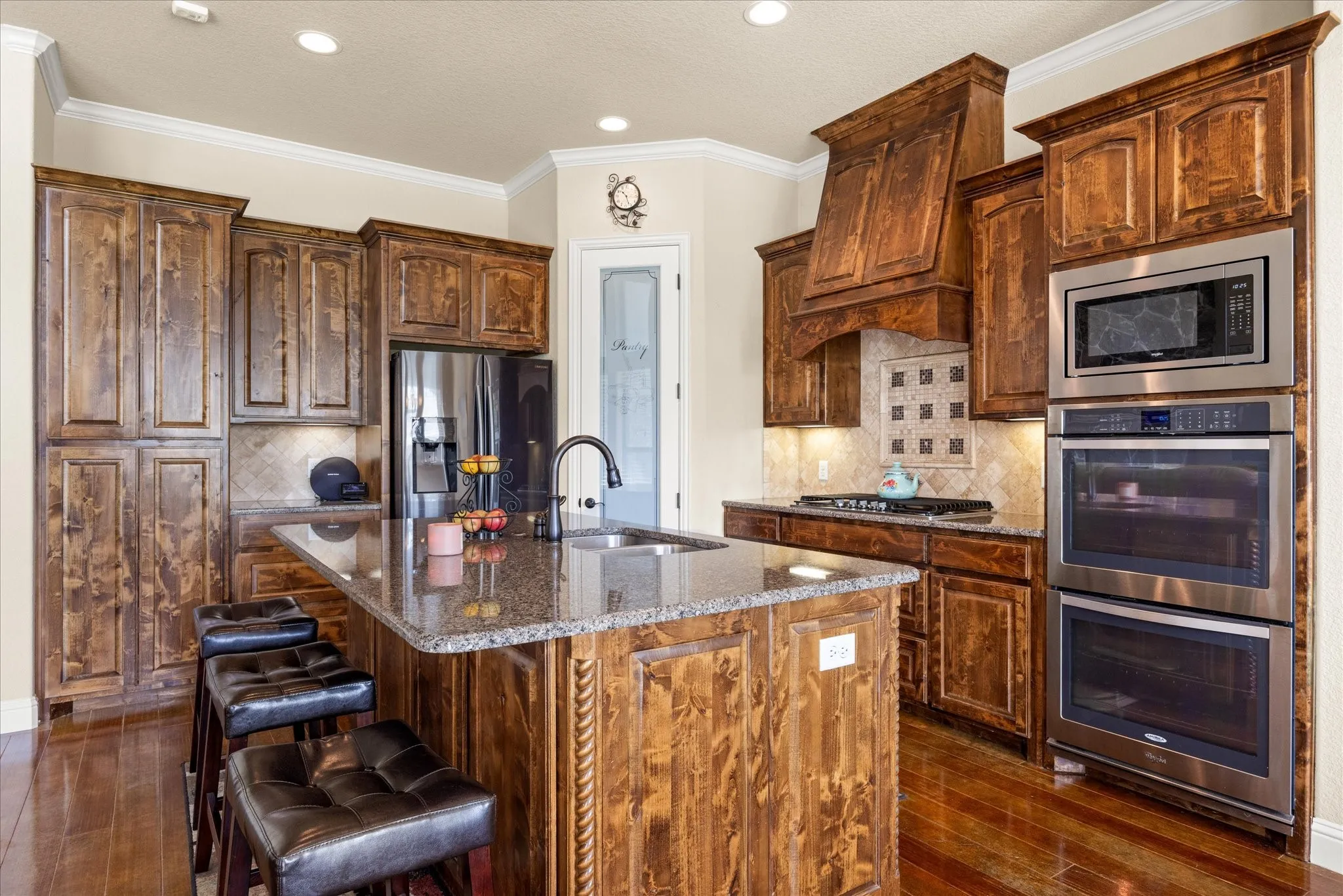 Custom knotty alder cabinets, plenty of storage, beautiful natural light.