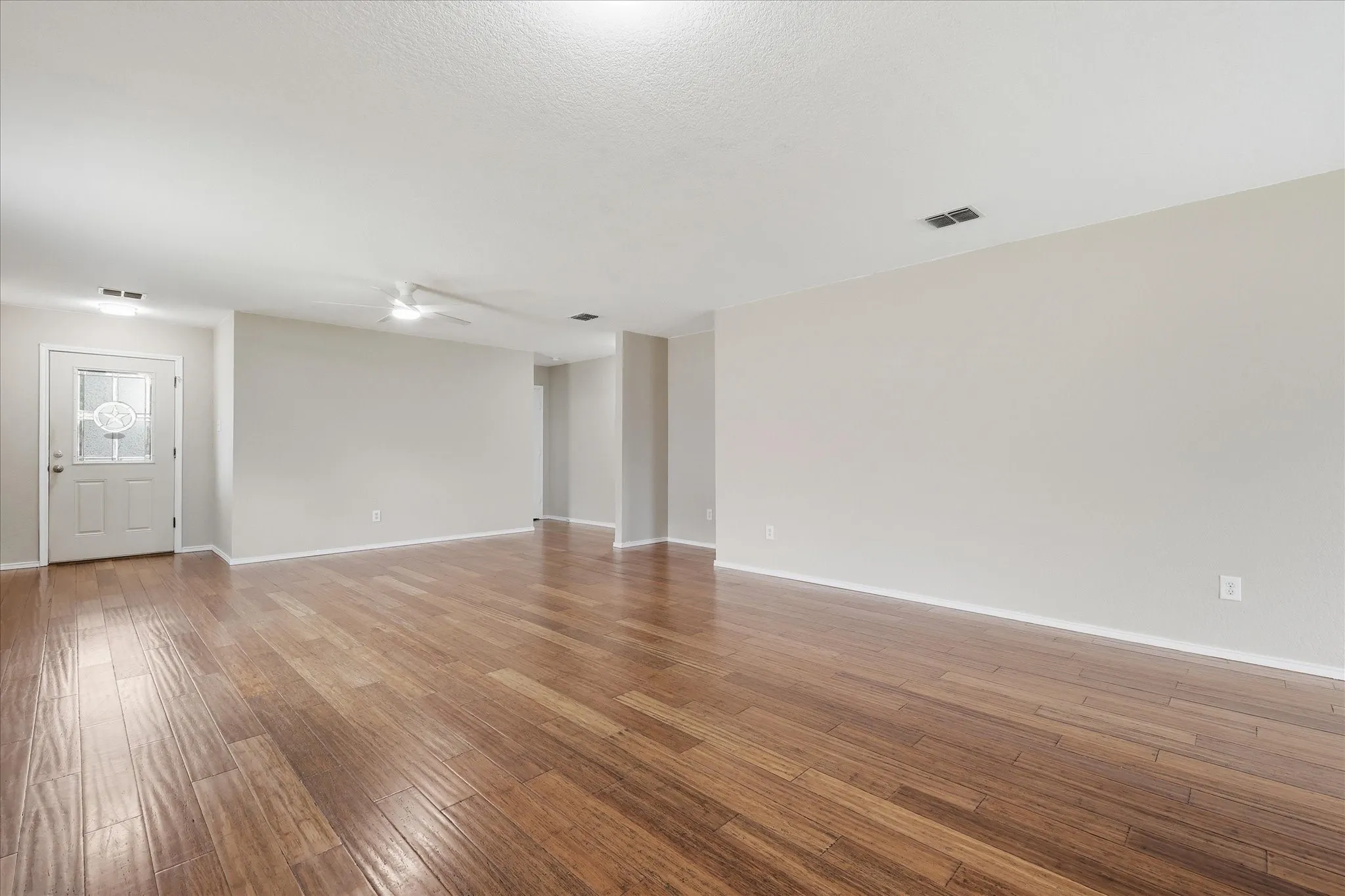 Spacious interior with wood-finish flooring throughout