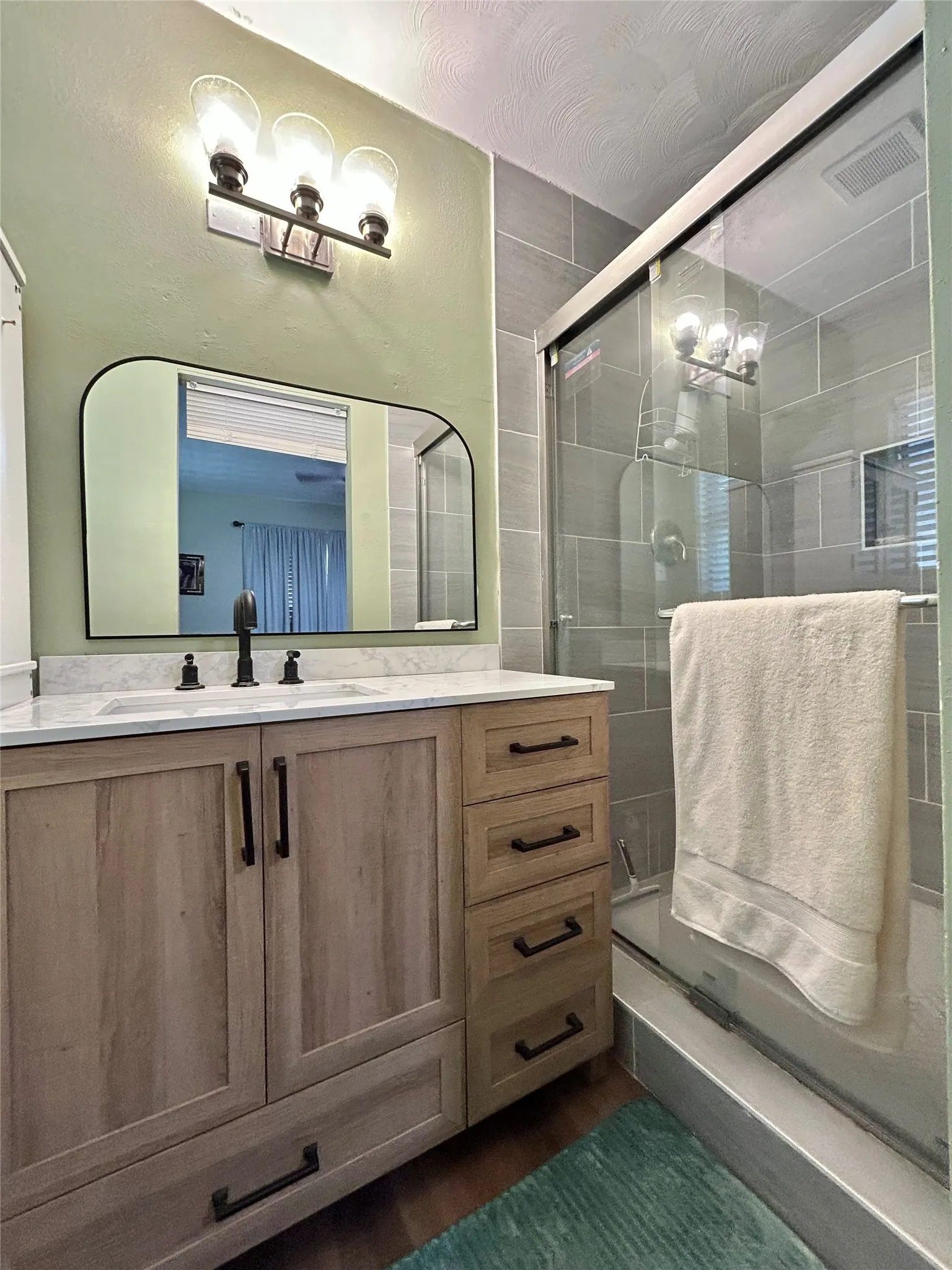 Primary Bathroom with Tile Walk in Shower