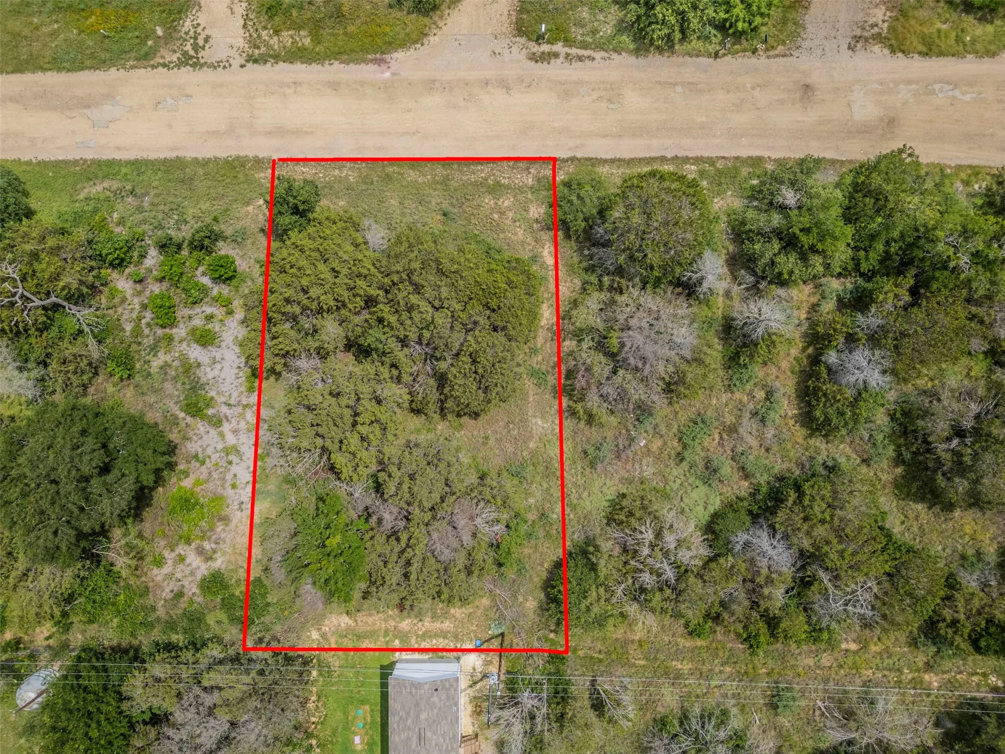 Expansive undeveloped land parcel outlined by a red boundary