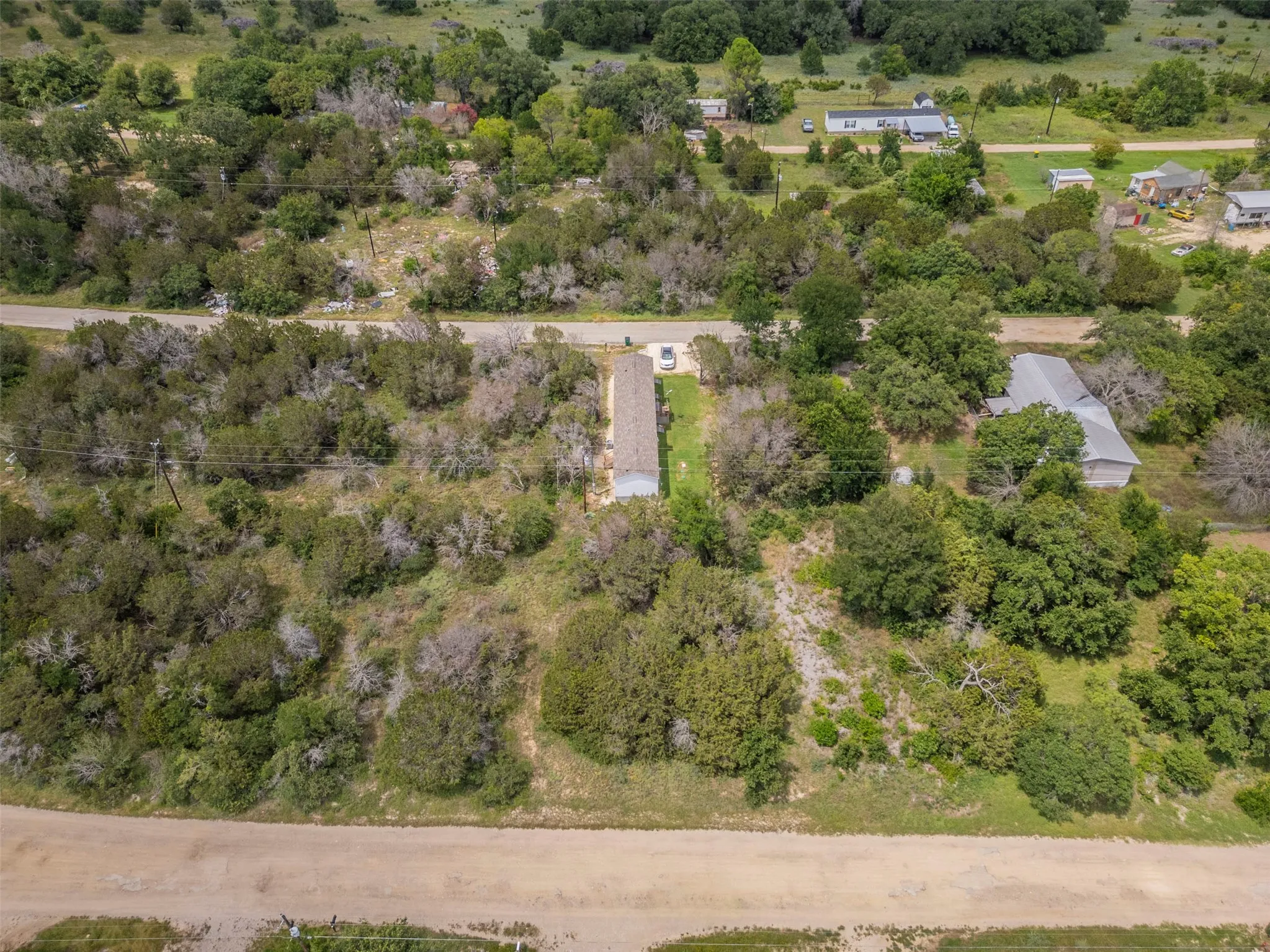 Expansive lot featuring mature trees and natural landscaping