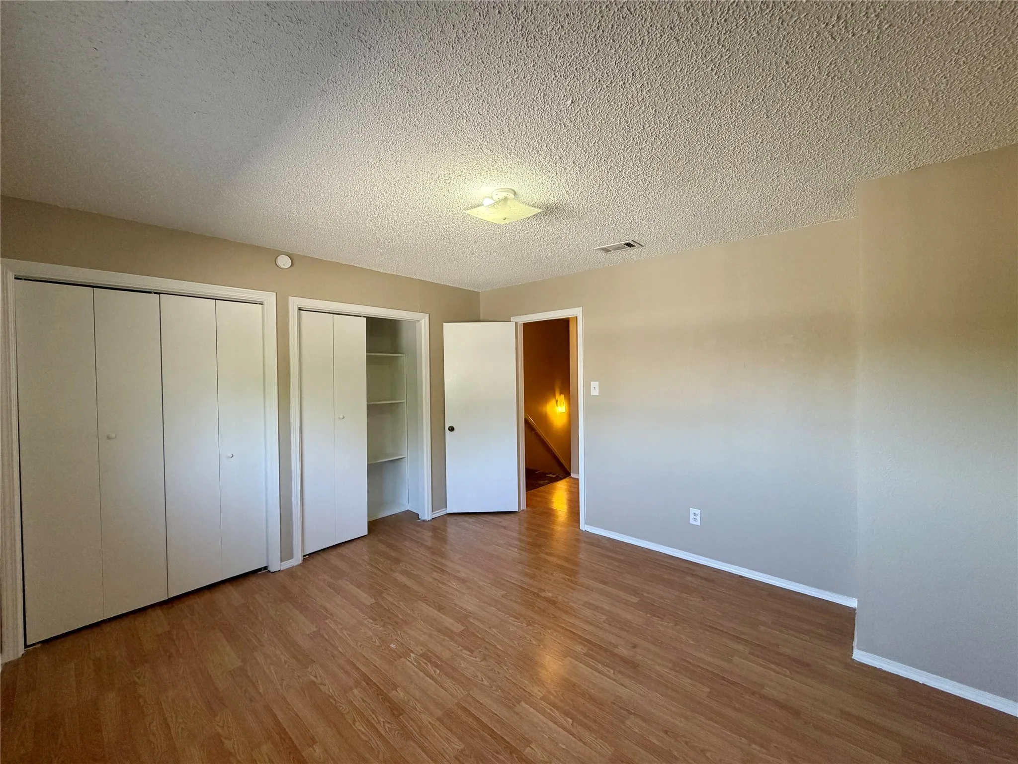 Wood-finish flooring with neutral wall tones