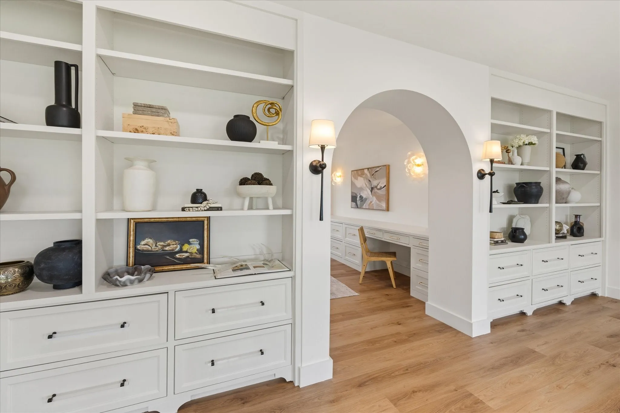 As You Enter the Upstairs You're Greeted by More Custom Cabinetry, Integrated Storage, and Continuing Architectural Arches