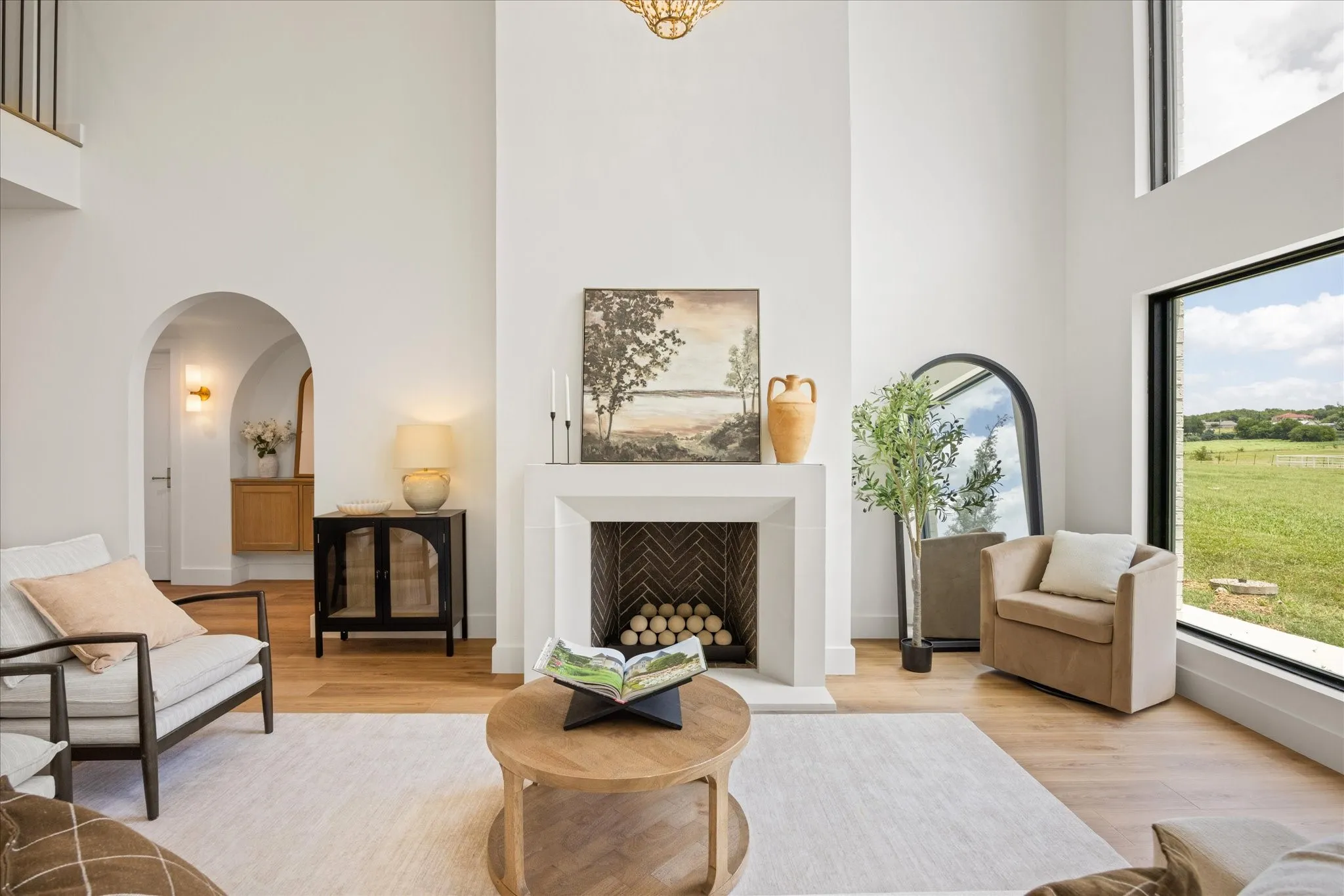 Spacious Living Area with Gorgeous Views, and a 5' Hand-Cut Stone Gas Fireplace Featuring Propane Fireballs