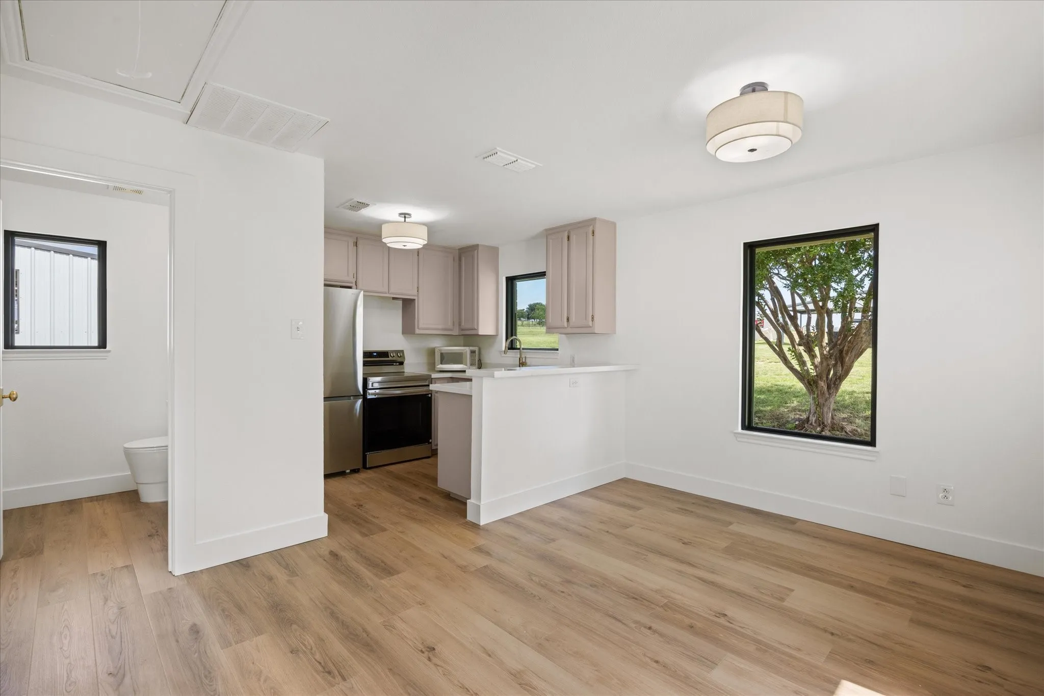 Quartz Countertops Throughout. All Appliances Convey including Fridge, Washer and Dryer