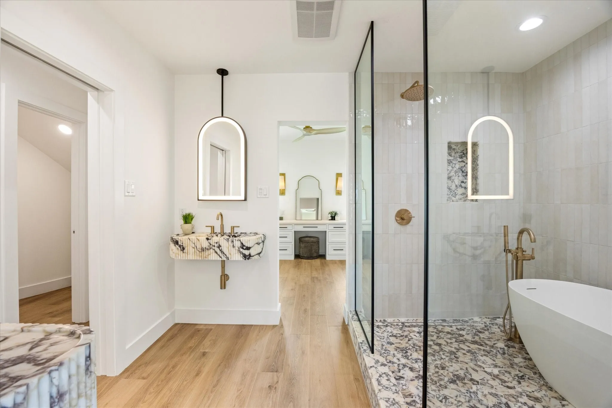 Wrapped in Imported Turkish Viola Marble, the Primary Bathroom Offers A Sophisticated Spa Experience
