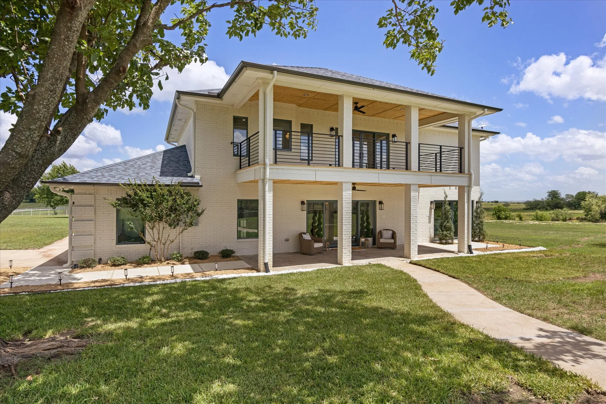 Expansive Covered Patios and Private Second-Story Balcony