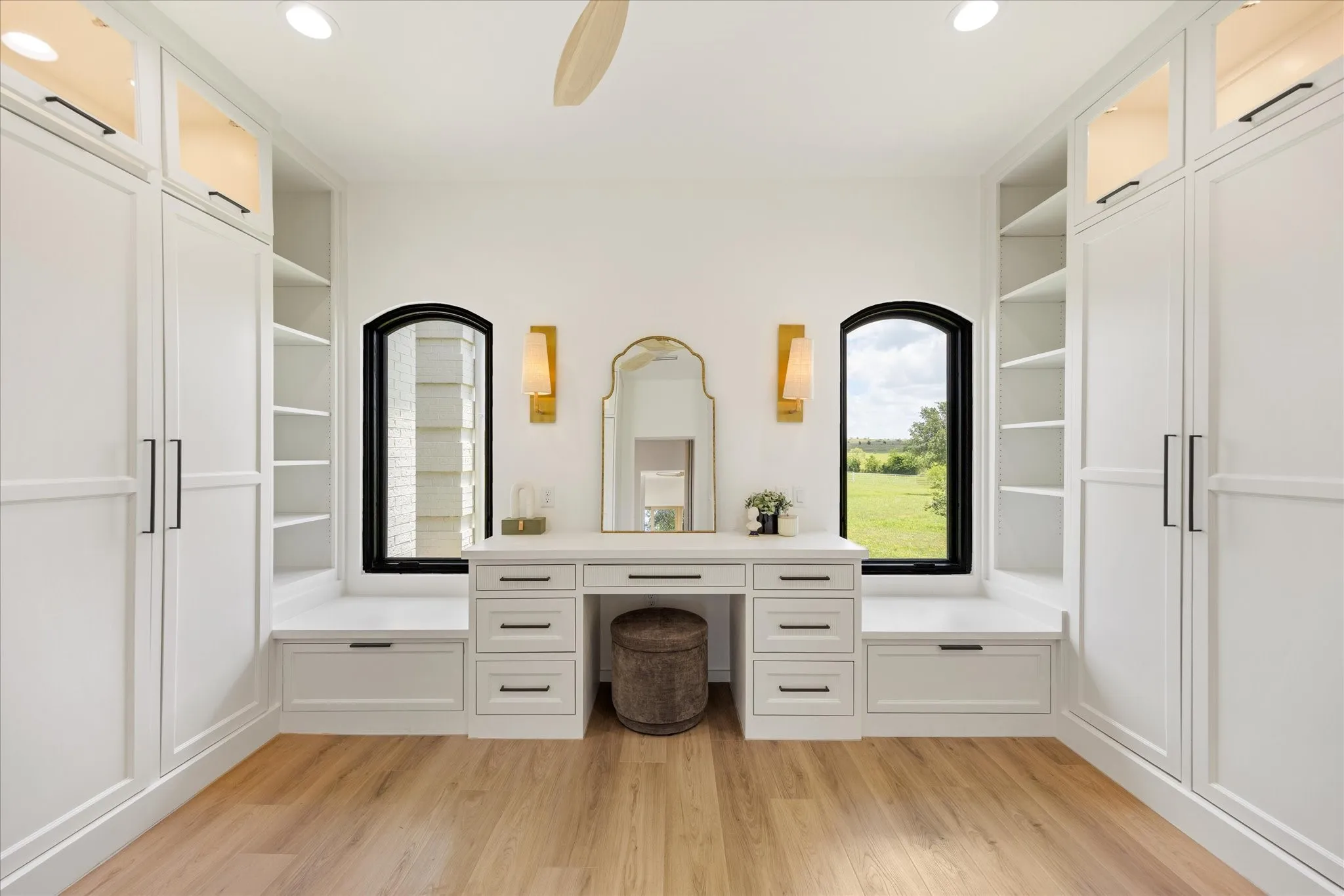 Custom Dressing Room Offering Floor-to-Ceiling Cabinetry, Abundant Storage, and Thoughtfully Designed Vanity Area