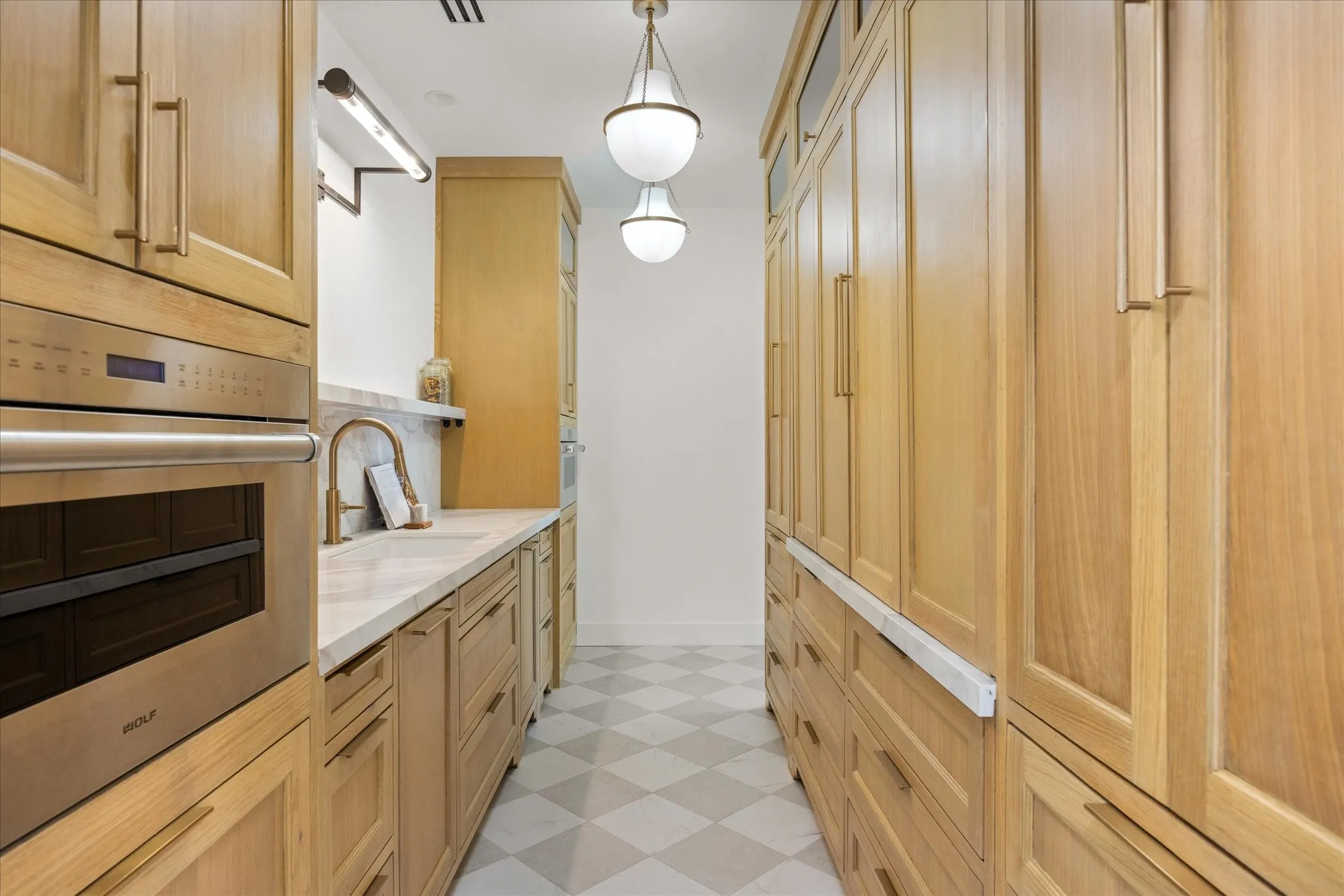 Custom Butler's Pantry also Includes Diamond Tile Floors, Appliance Garage, and Storage, Storage, Storage