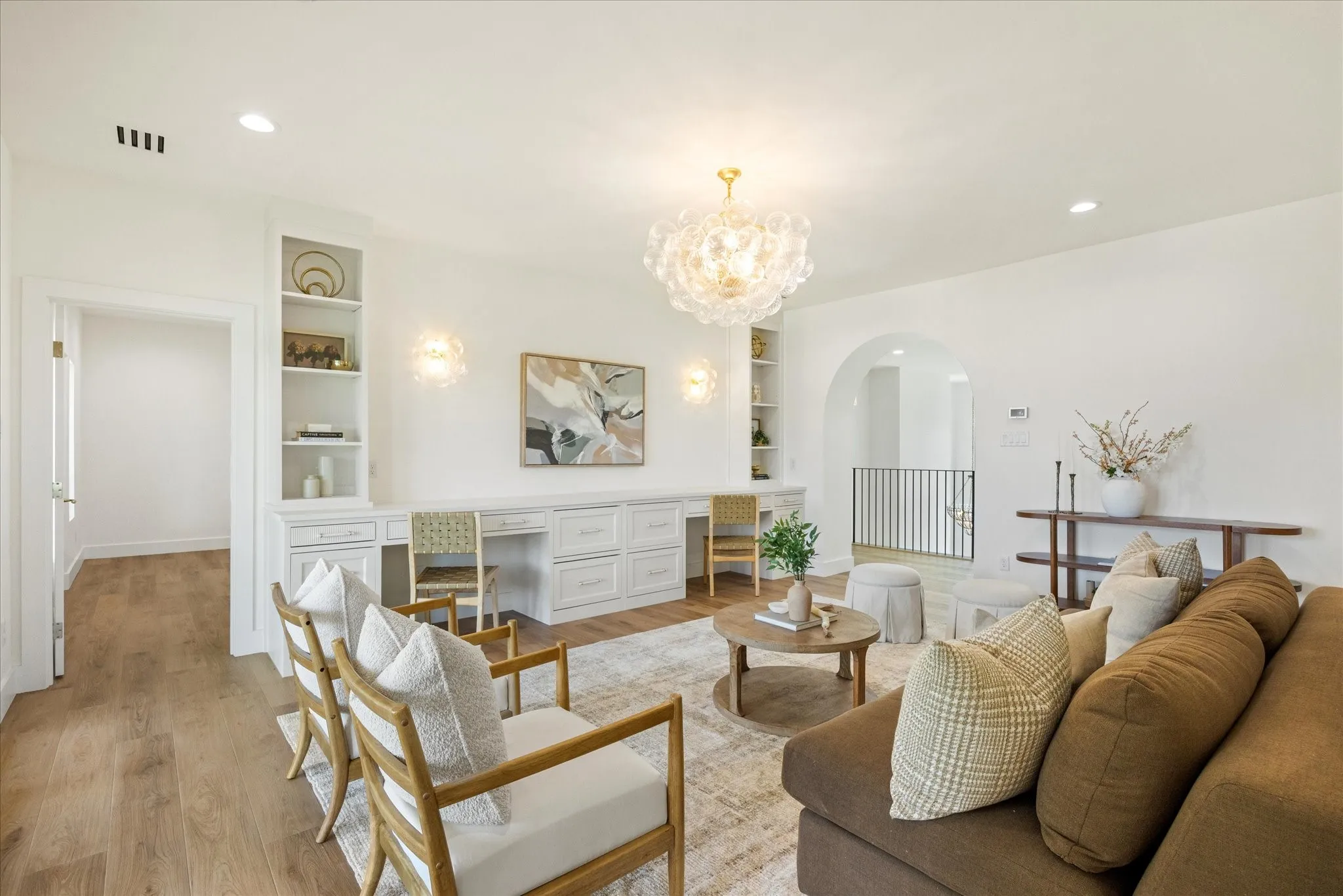 Upstairs You'll Find Two Additional Bedrooms with En Suites and Built-Ins and Storage