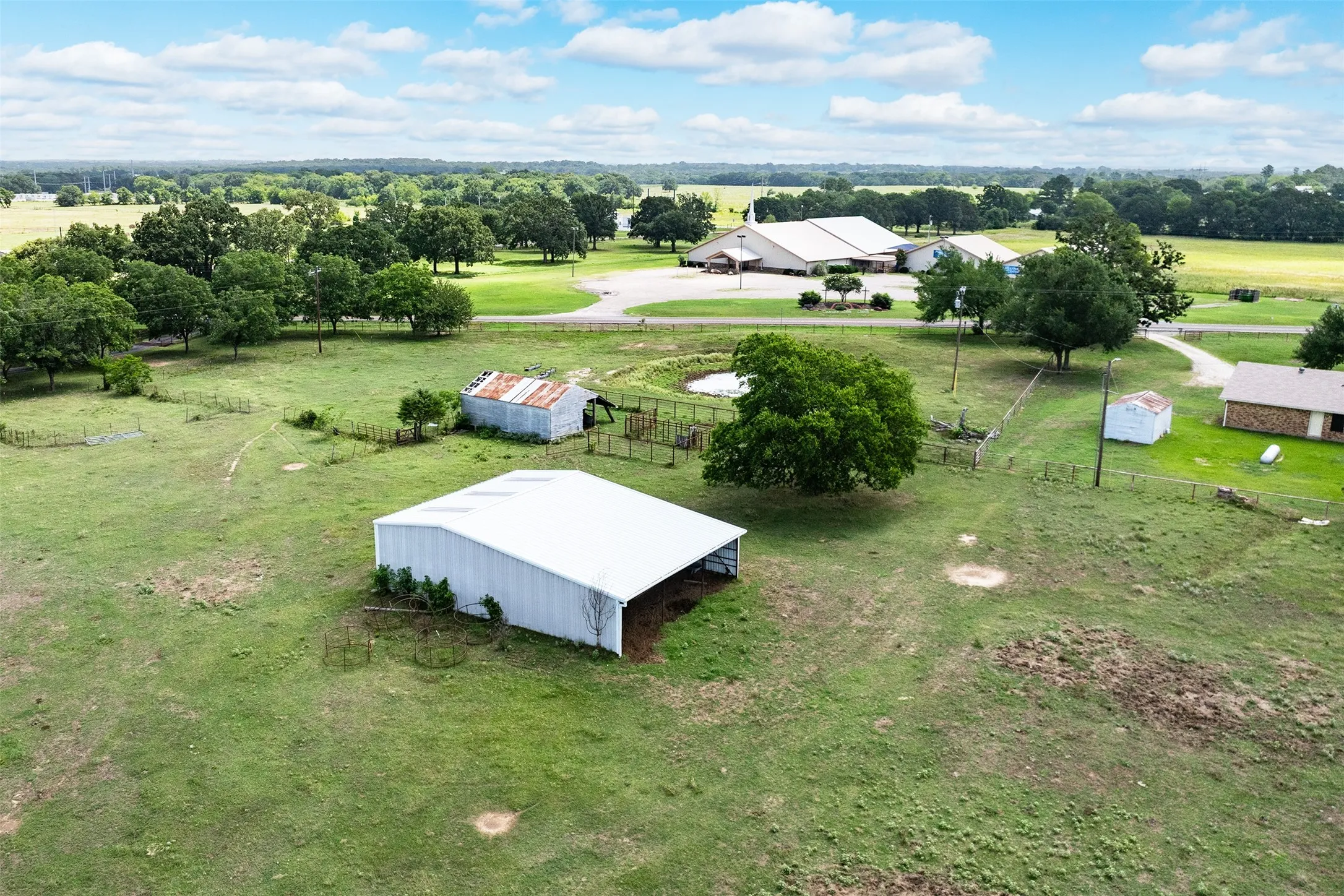 Expansive green acreage with multiple structures