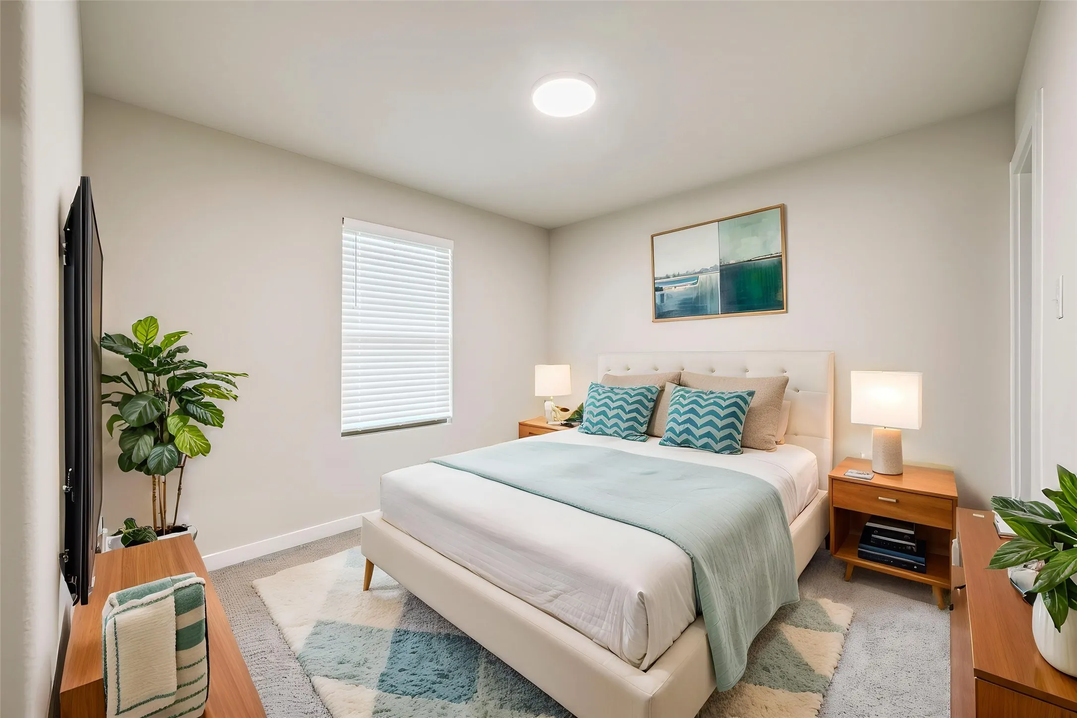 Neutral-toned walls complement a window with horizontal blinds and a ceiling-mounted light fixture