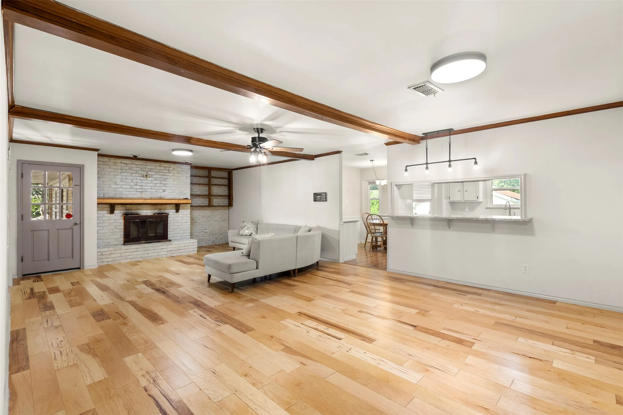 Spacious living room with engineered hardwood flooring