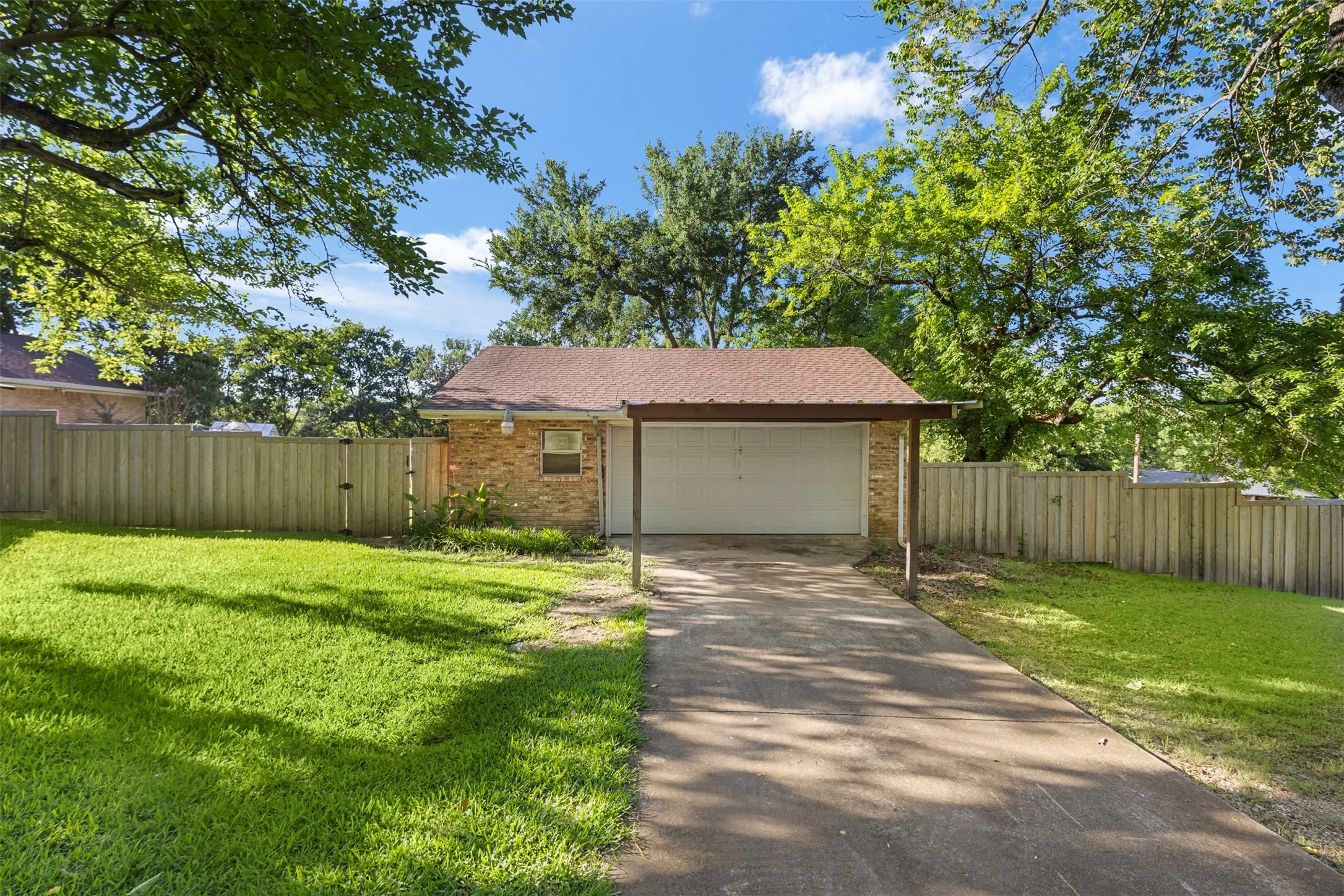 Oversized detached 2 car garage with a bathroom inside!