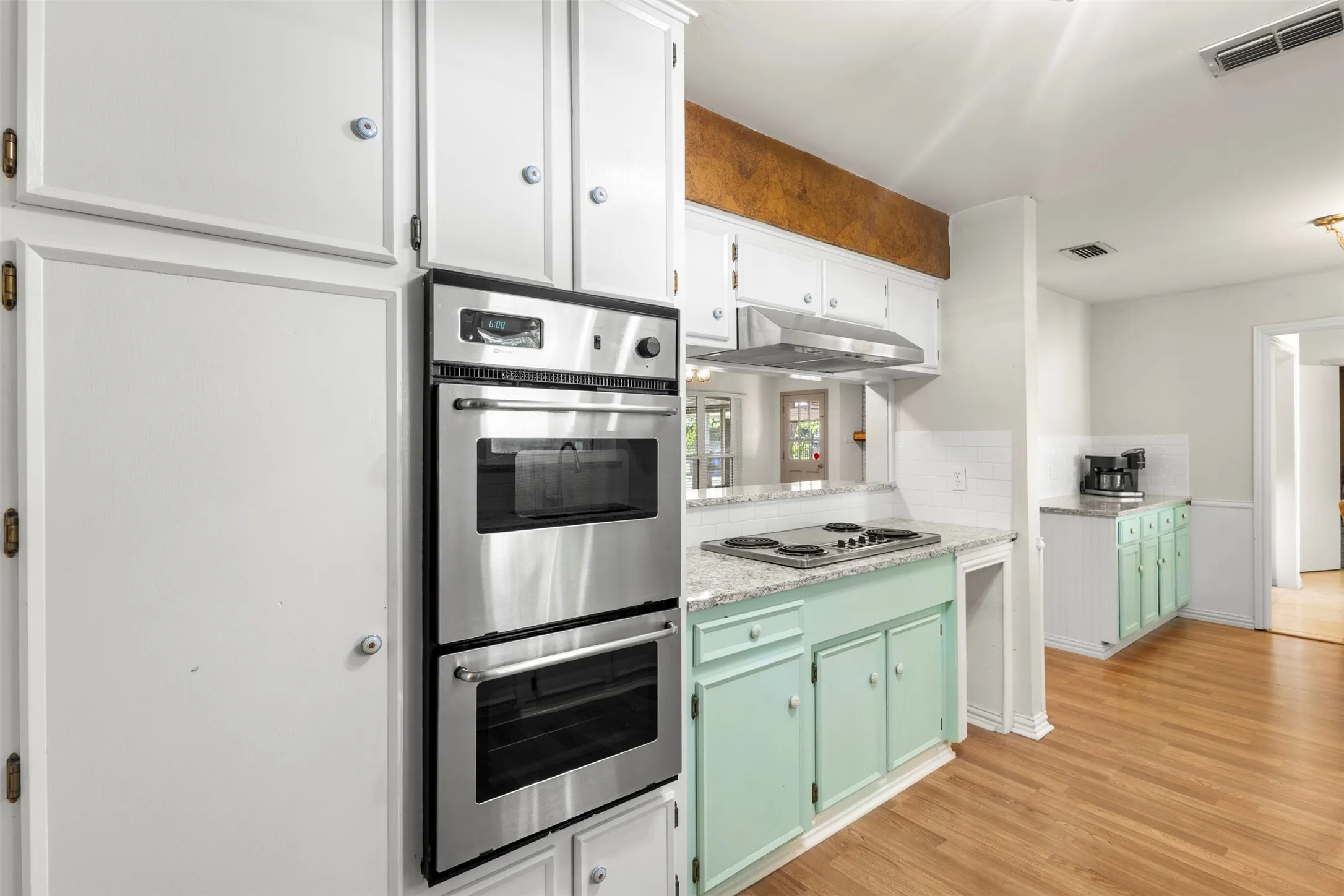 Double oven and extra cabinet and counter space with a butler pantry-type area