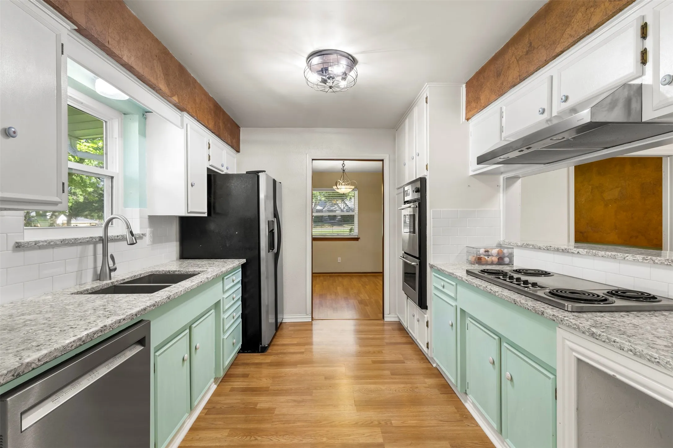 Refinished cabinets and quartz countertops