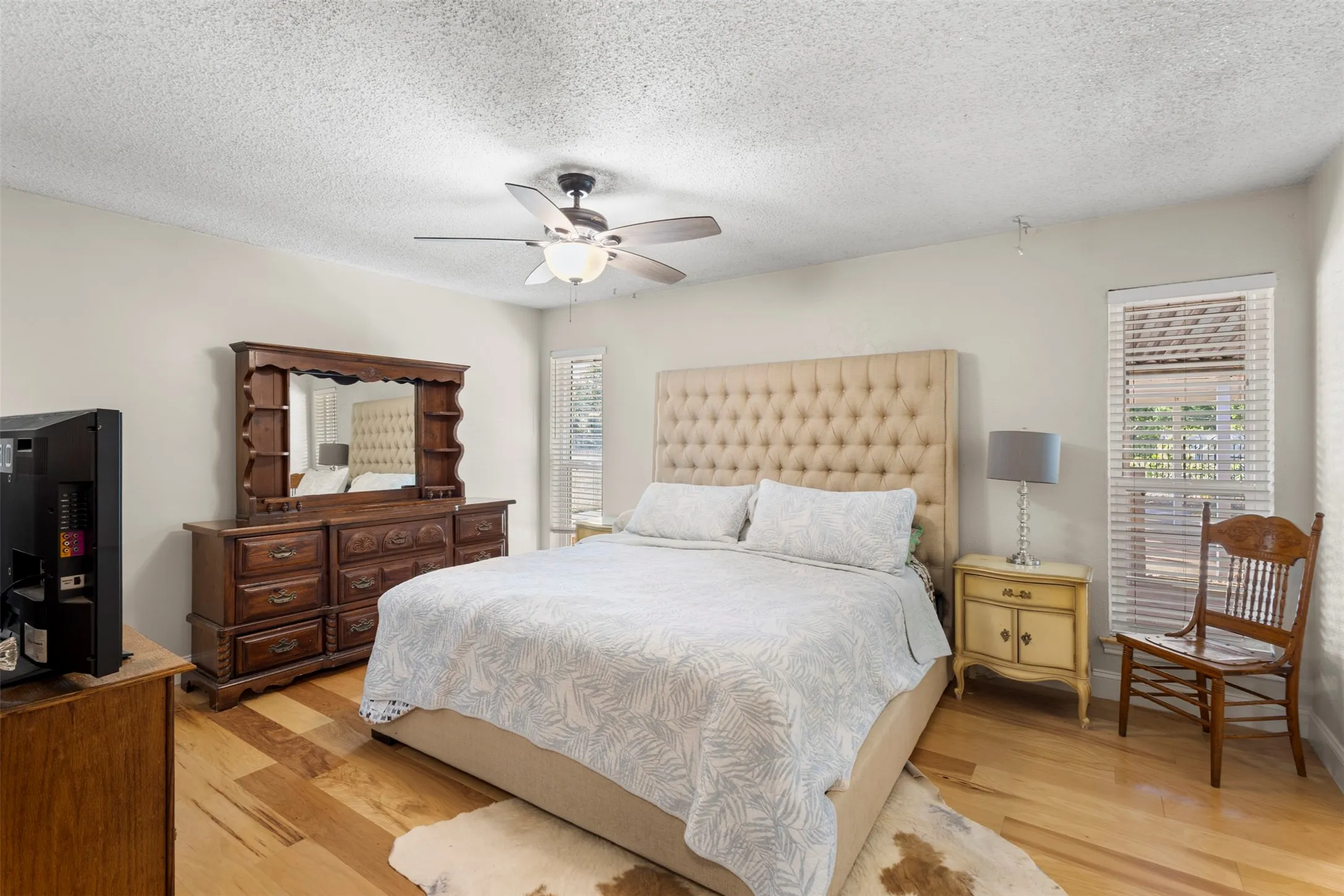 Primary bedroom with multiple large walk-in closets