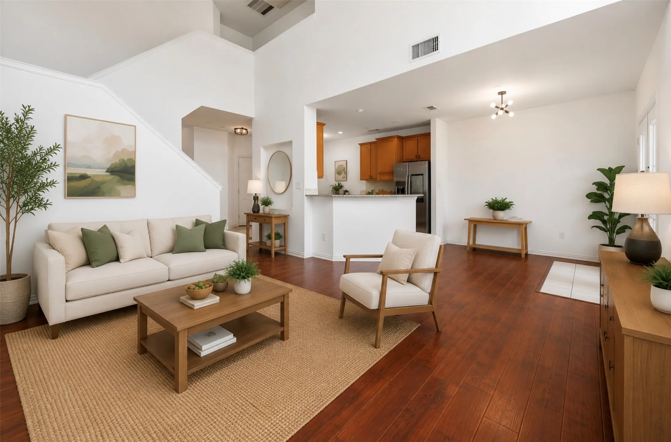 Expansive living area featuring soaring ceilings and rich wood-finish flooring