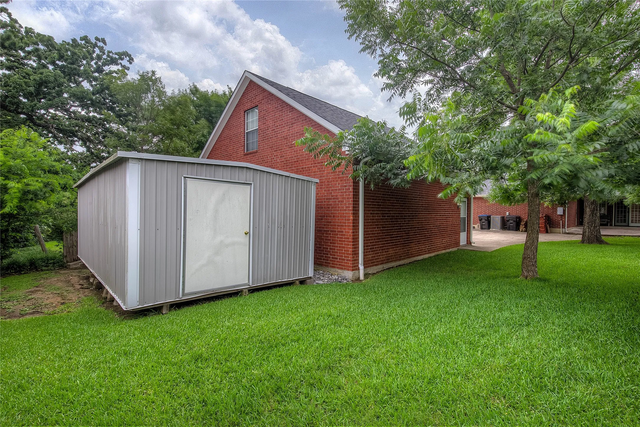 Detached garage with extra storage building at rear