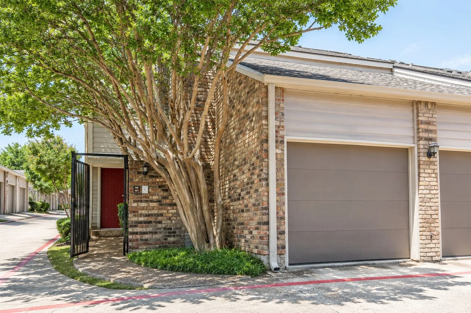 Garage opens to locked courtyard
