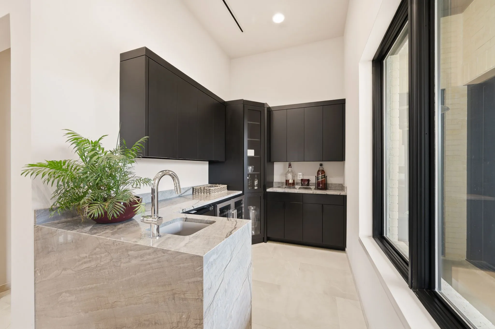 Sophisticated gathering bar highlighted by contemporary desig elements.