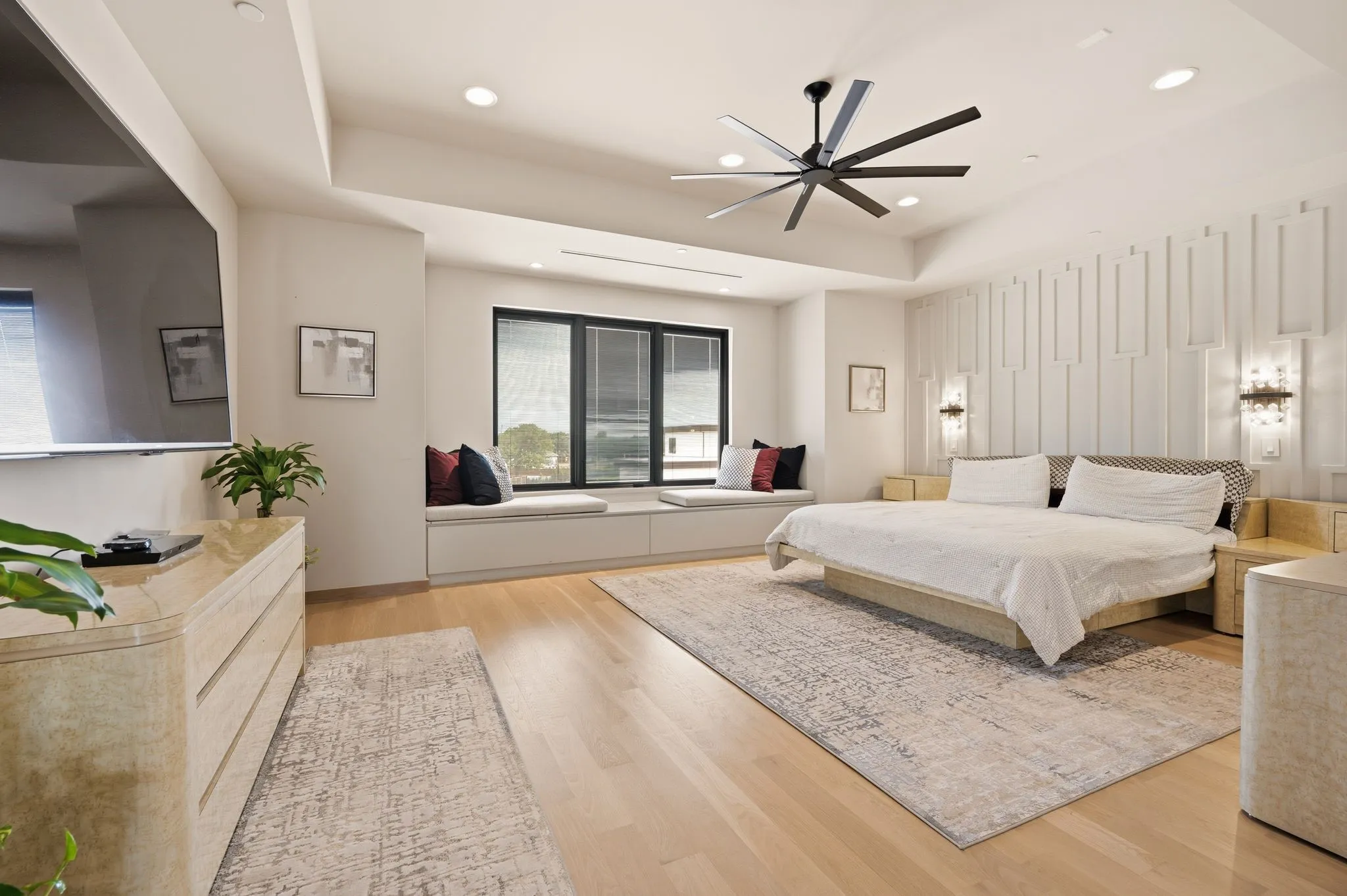 Spacious primary retreat with designer details and serene ambiance.