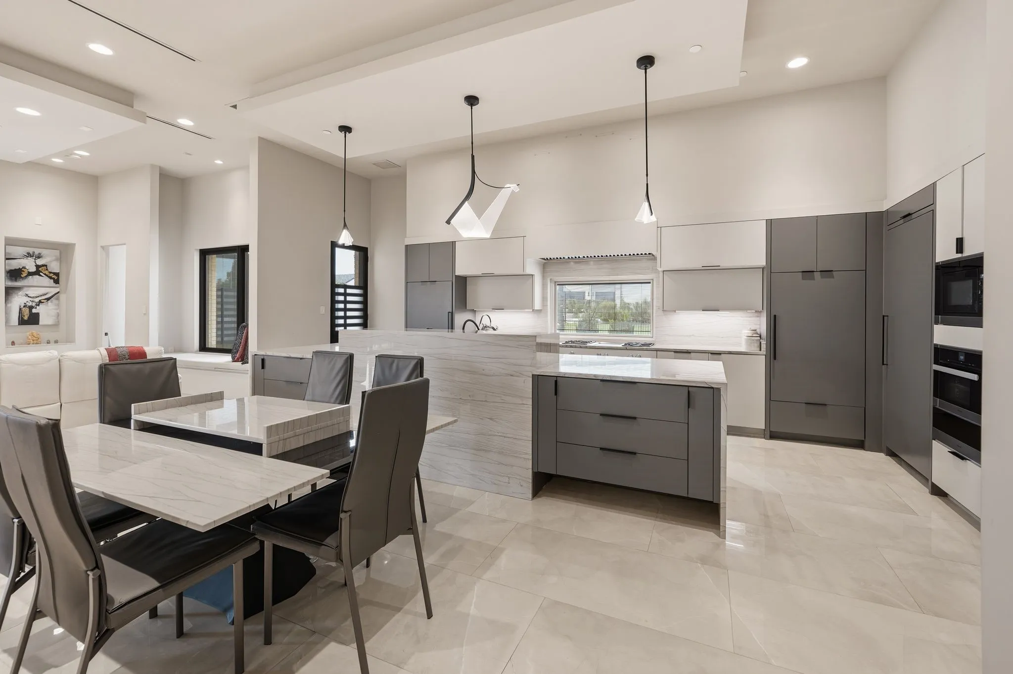 Chef's kitchen featuring premium appliances and custom cabinetry. Double oven and Sub Zero refrigeration.