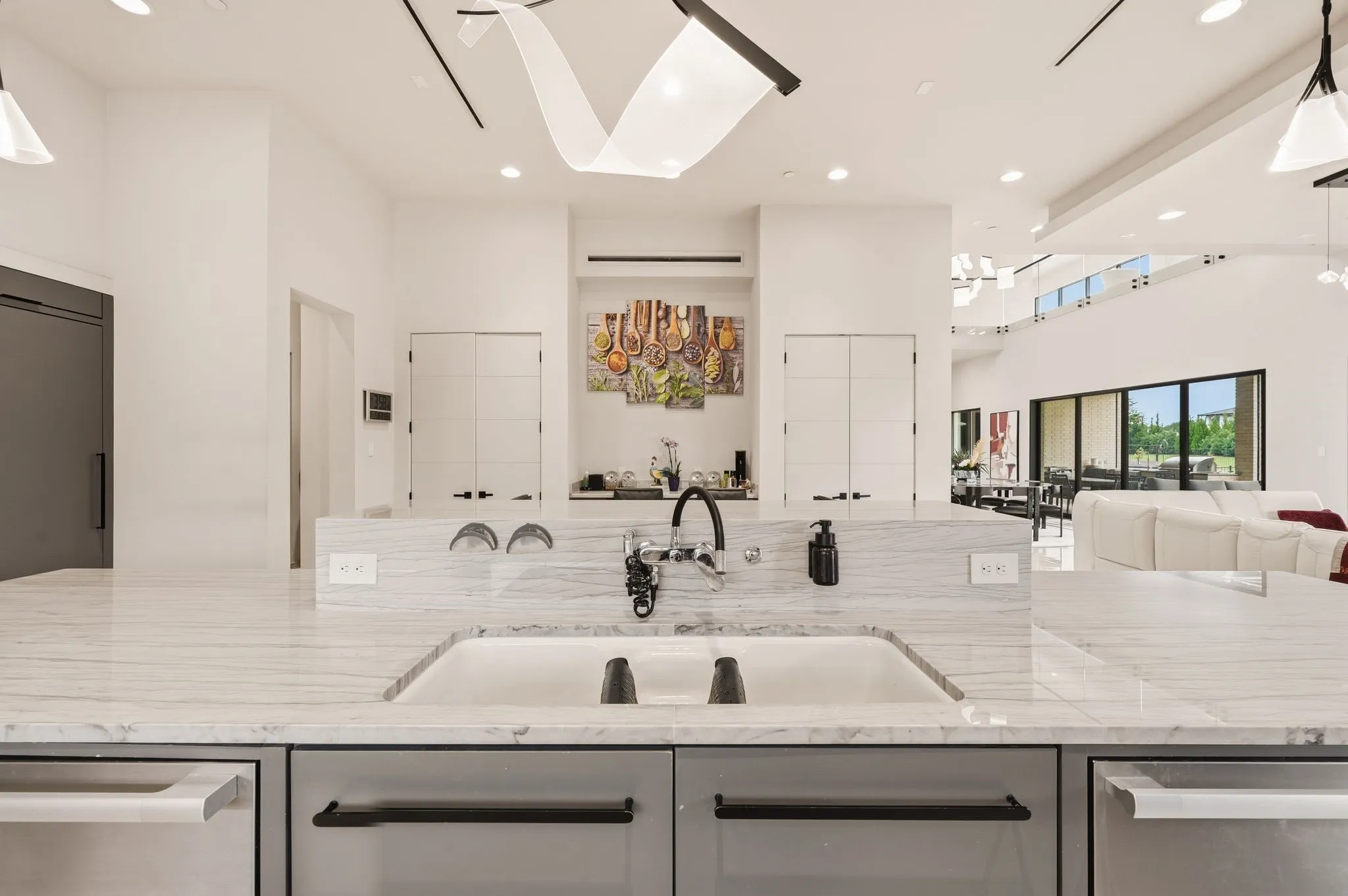 Expansive chef's kitchen centered around a statement island.
