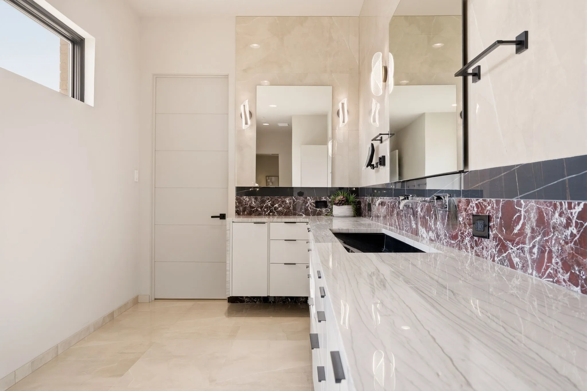 Luxurious primary bathroom with custom selections and elevated design.